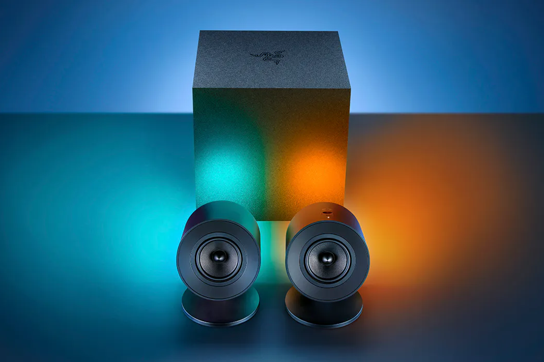 Razer Nommo V2 with RGB on sitting on top of a desk