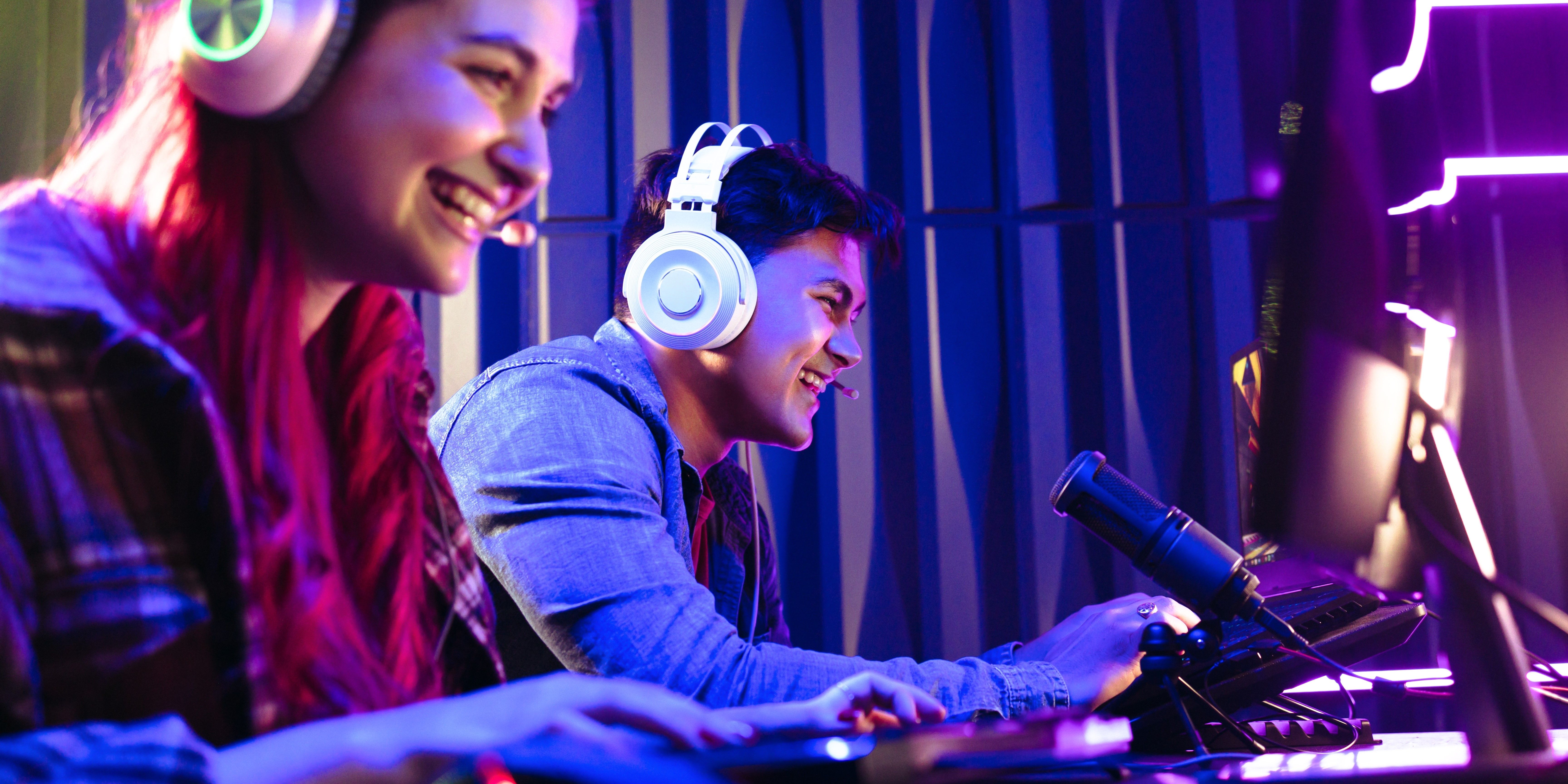 Two young gamers enjoying themselves as they engage in a fun online video game contest.