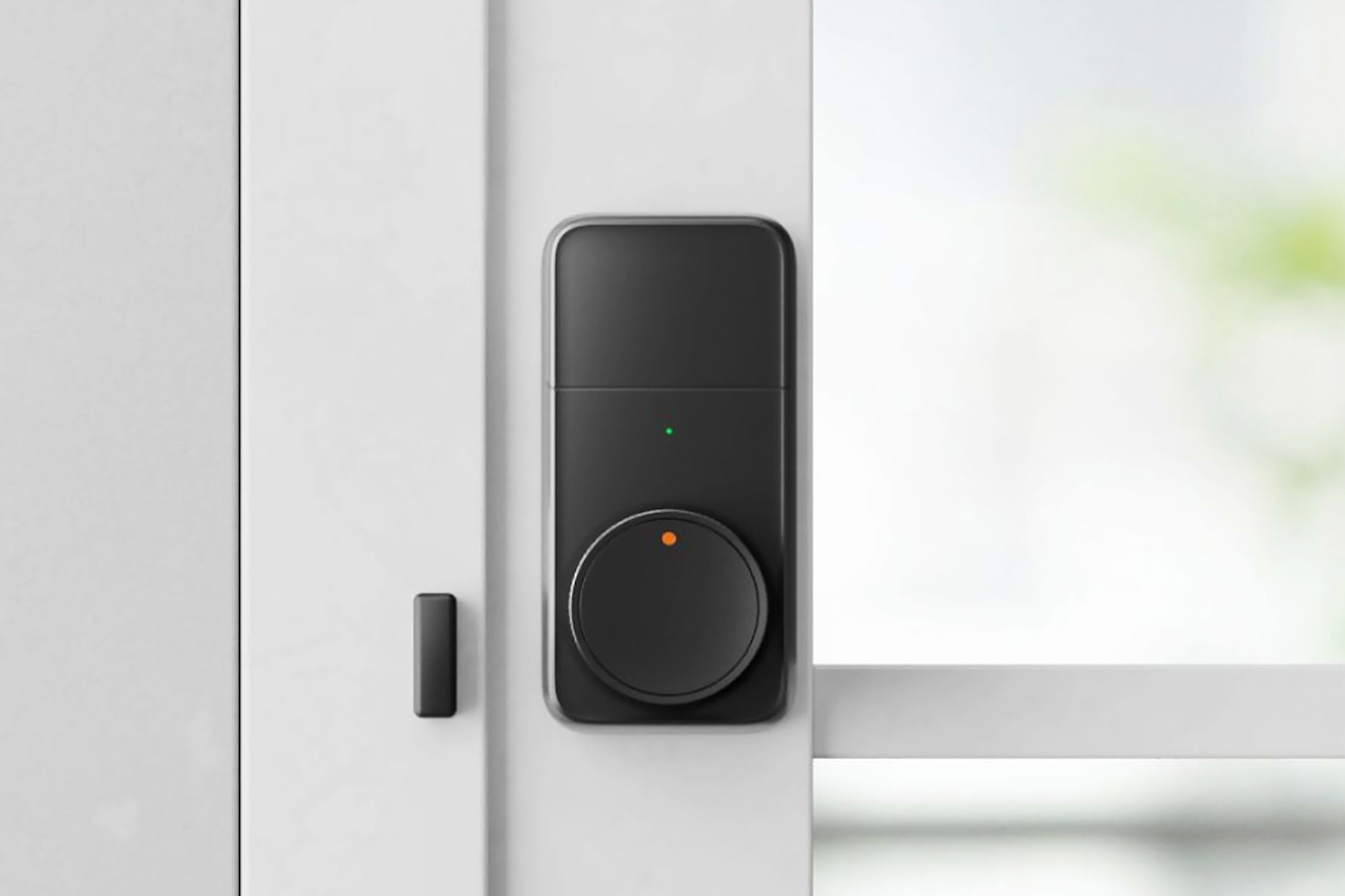 The SwitchBot Lock Pro installed on a door.