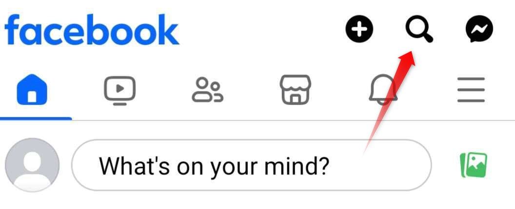 Pointing to the magnifying glass used for searching on Facebook.