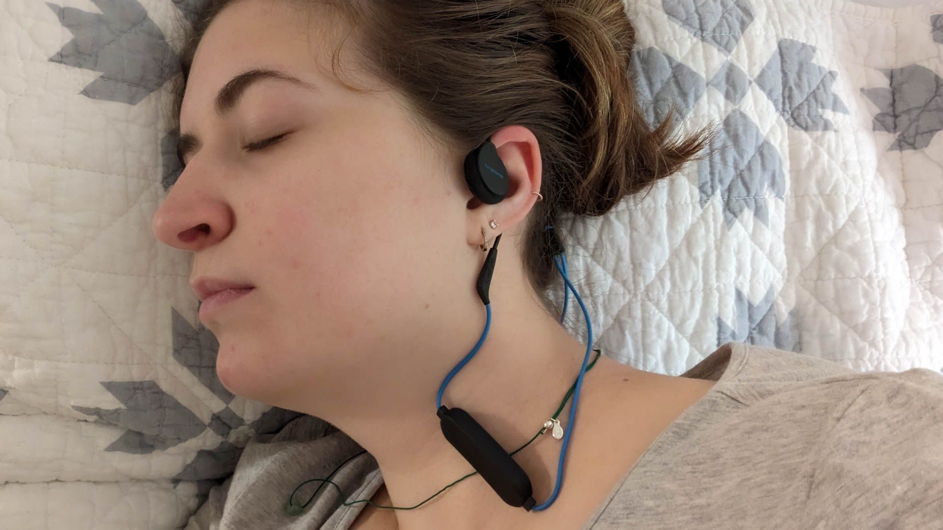 Person listening to music while sleeping with Bedphones