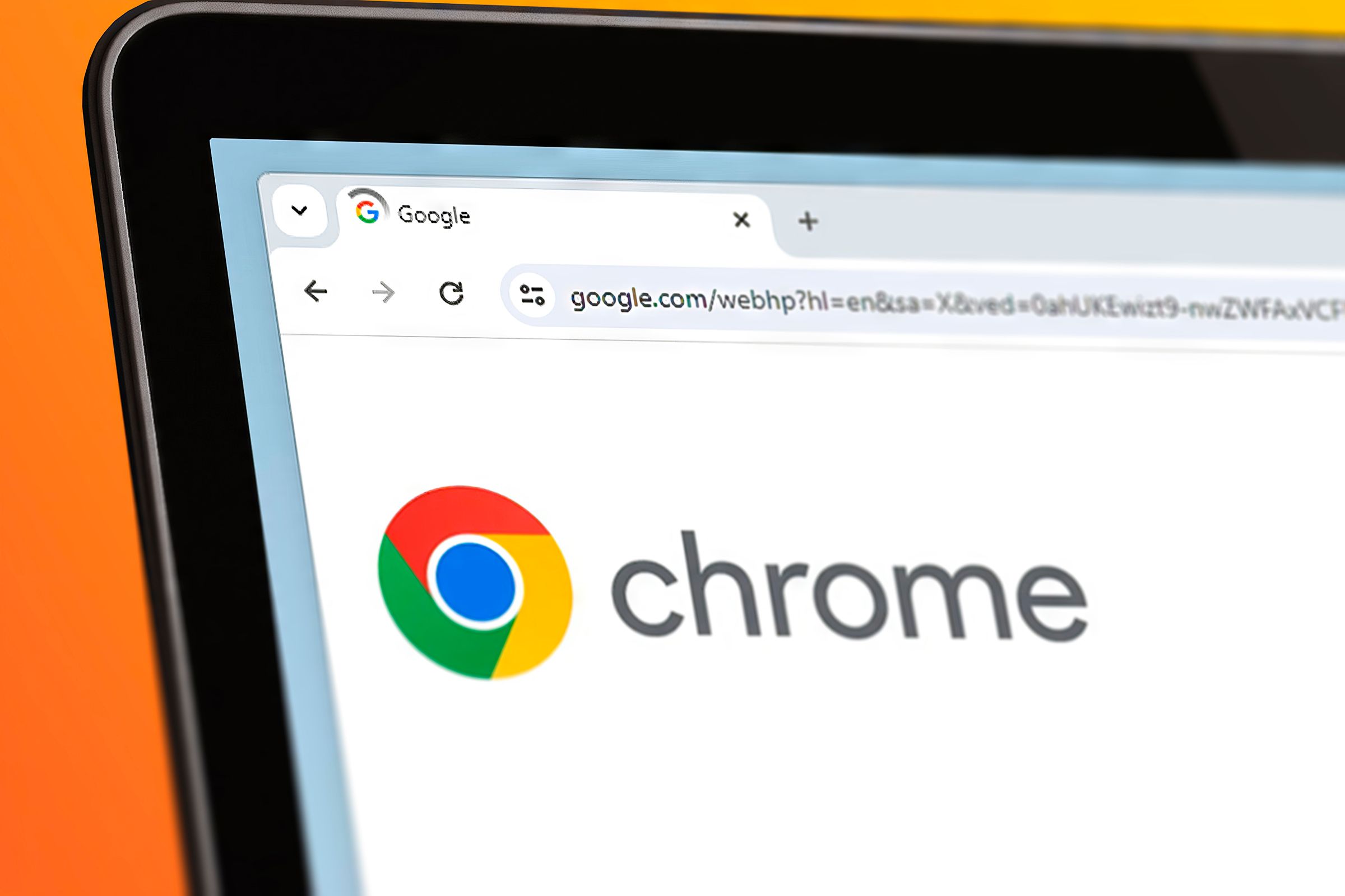 A close-up of a laptop screen with Google Chrome open reloading and the word 'Chrome' in the center.