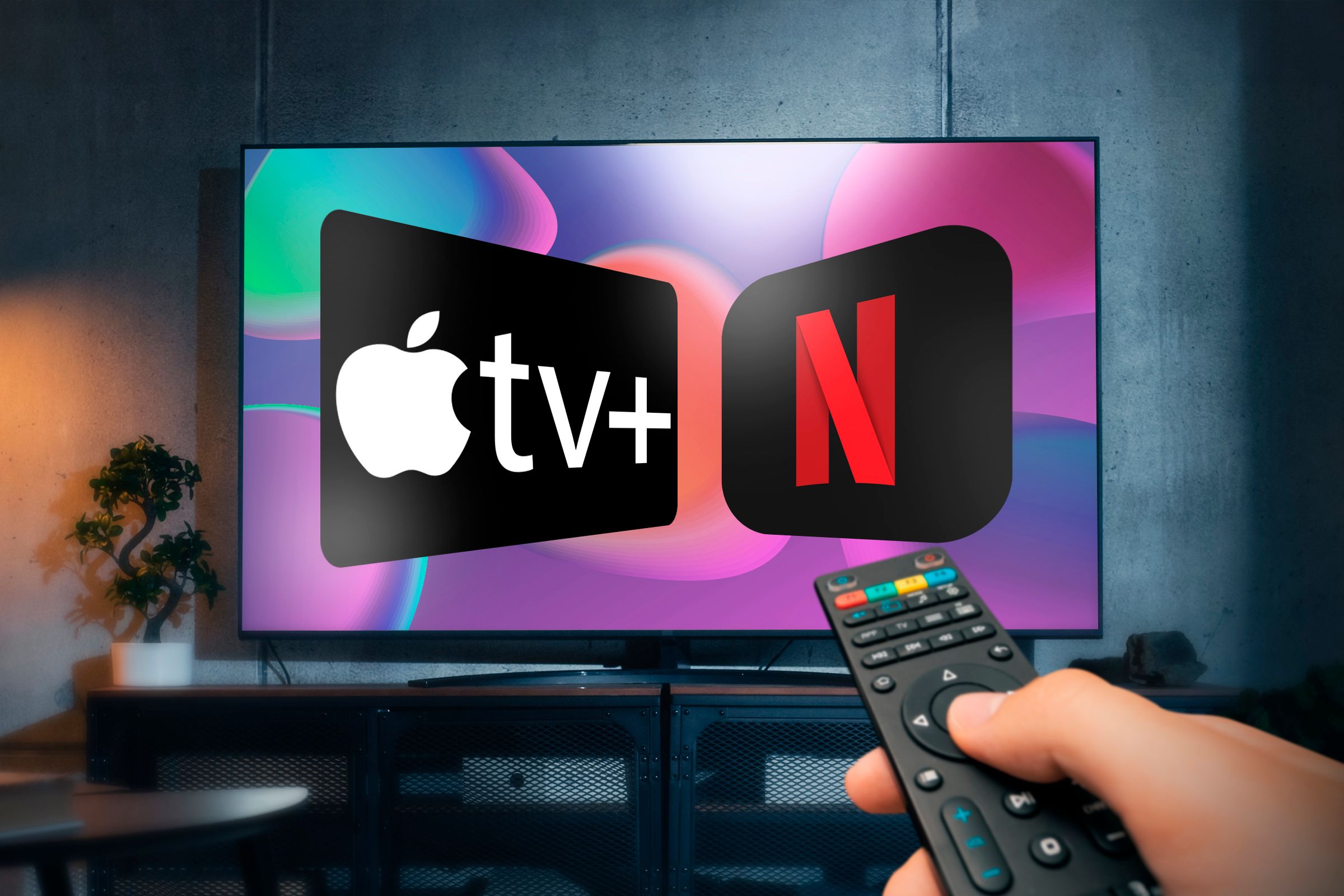 A TV with the Apple TV+ and Netflix logos on the screen with a hand holding a remote control on the right side.