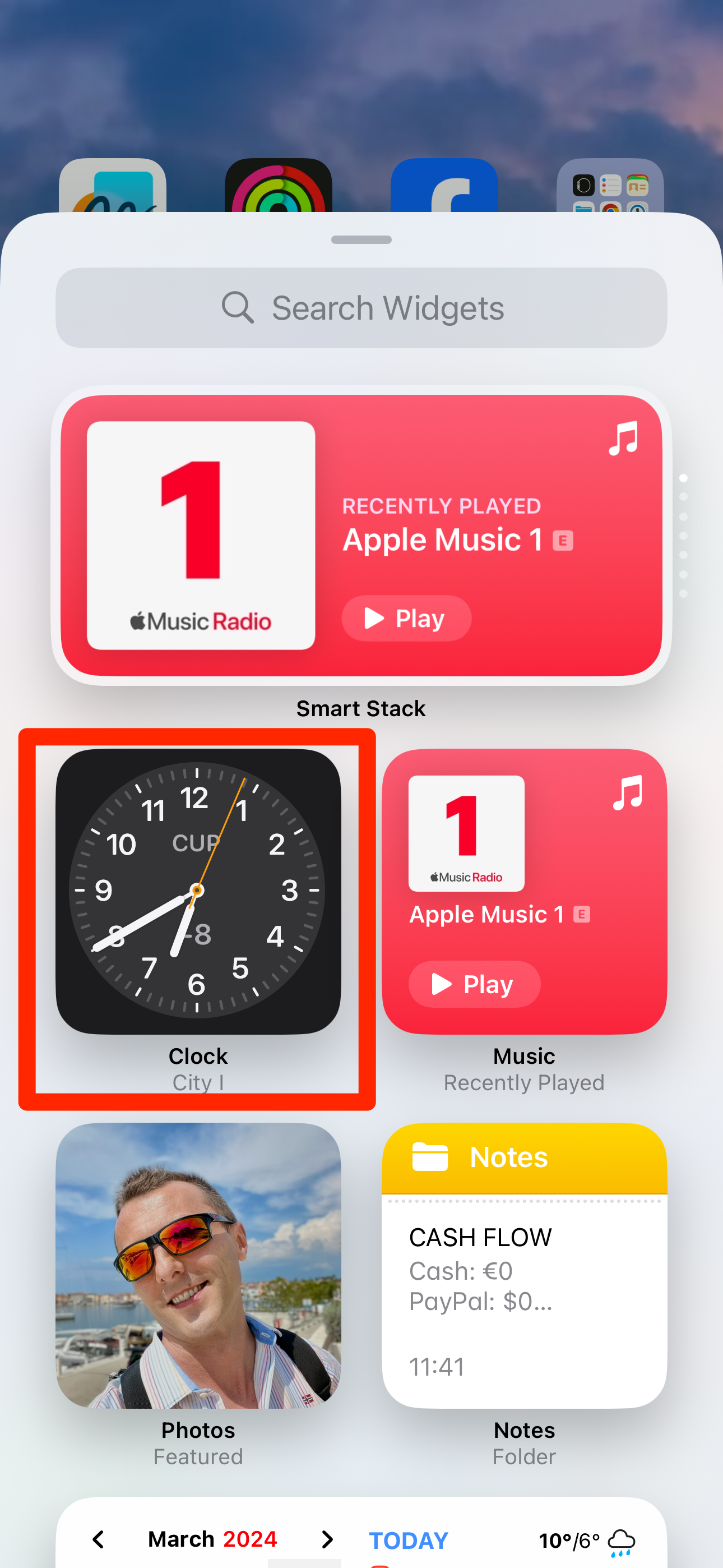 Clock app selected in the widget gallery on iPhone.