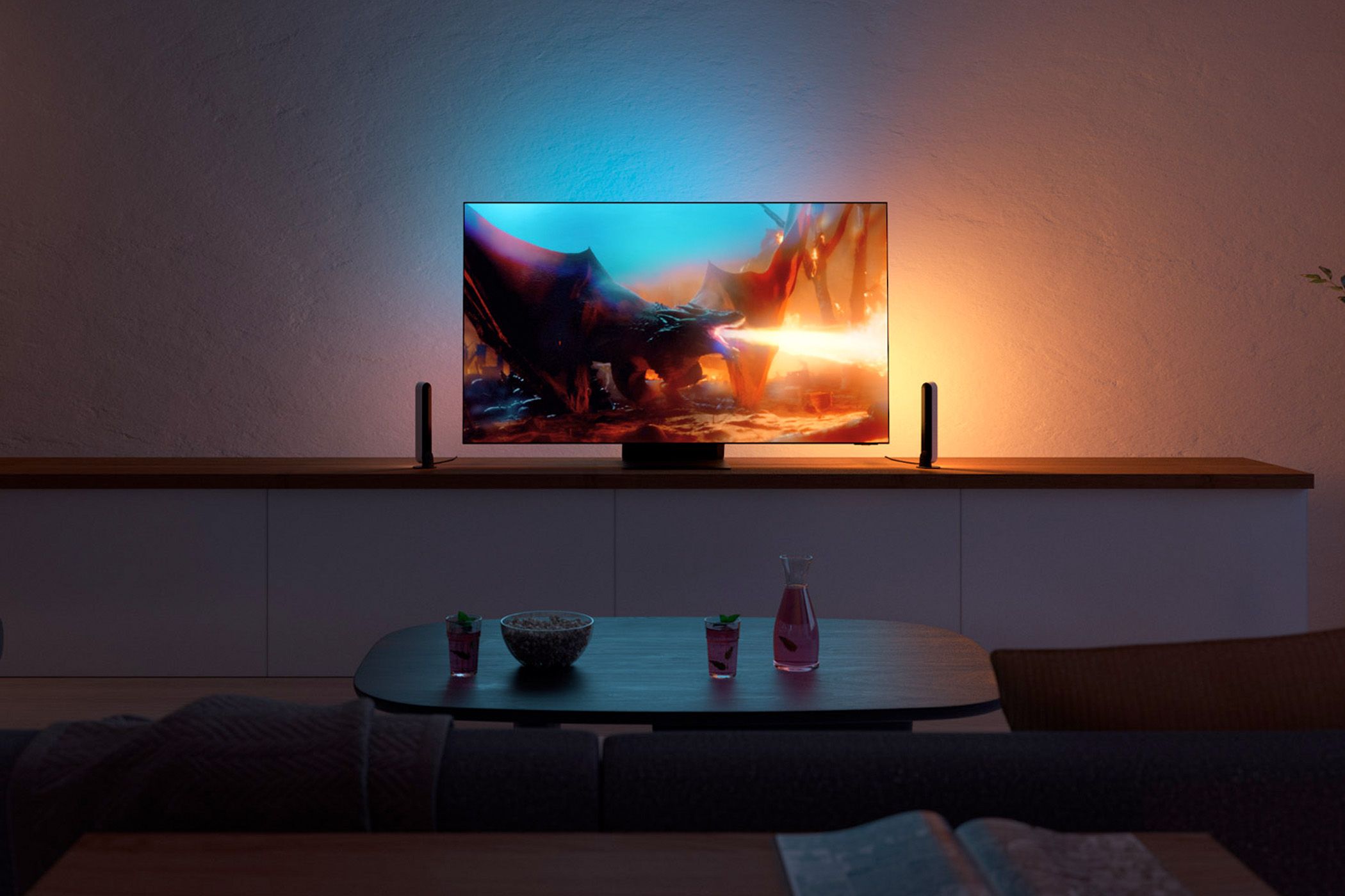 A TV with accent lighting that matches the colors of the TV's content.