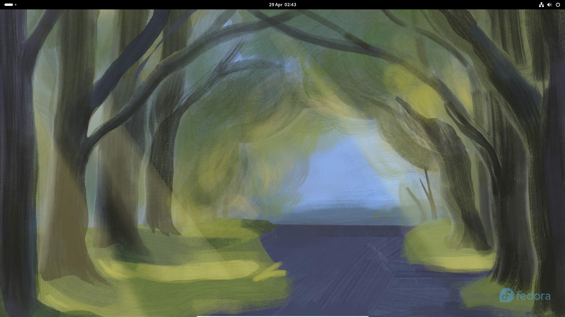 The Fedora 40 default GNOME desktop with a wallpaper showing a blurred forest scene