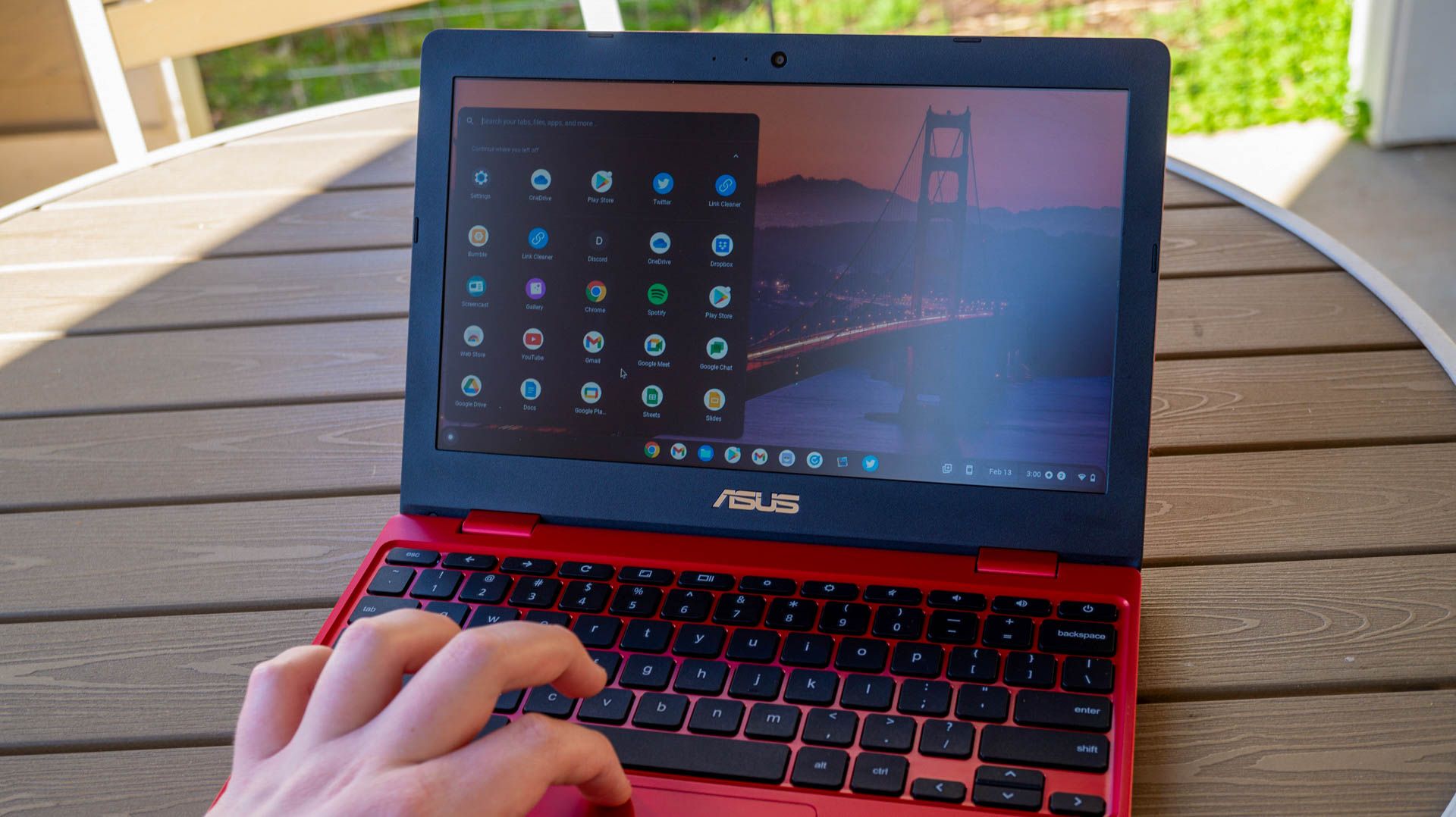 Using the ASUS Chromebook 12 on an outdoor table.