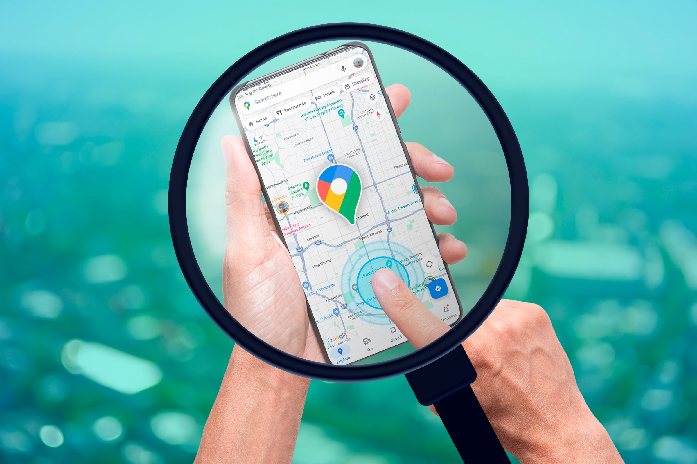 A magnifying glass showing a smartphone with Google Maps open and a person's finger pointing towards the screen.