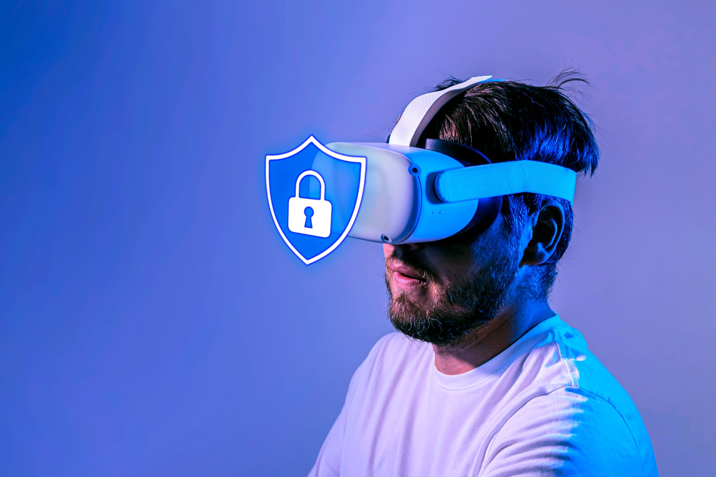 A man wearing a Meta VR headset with a security shield icon in front.