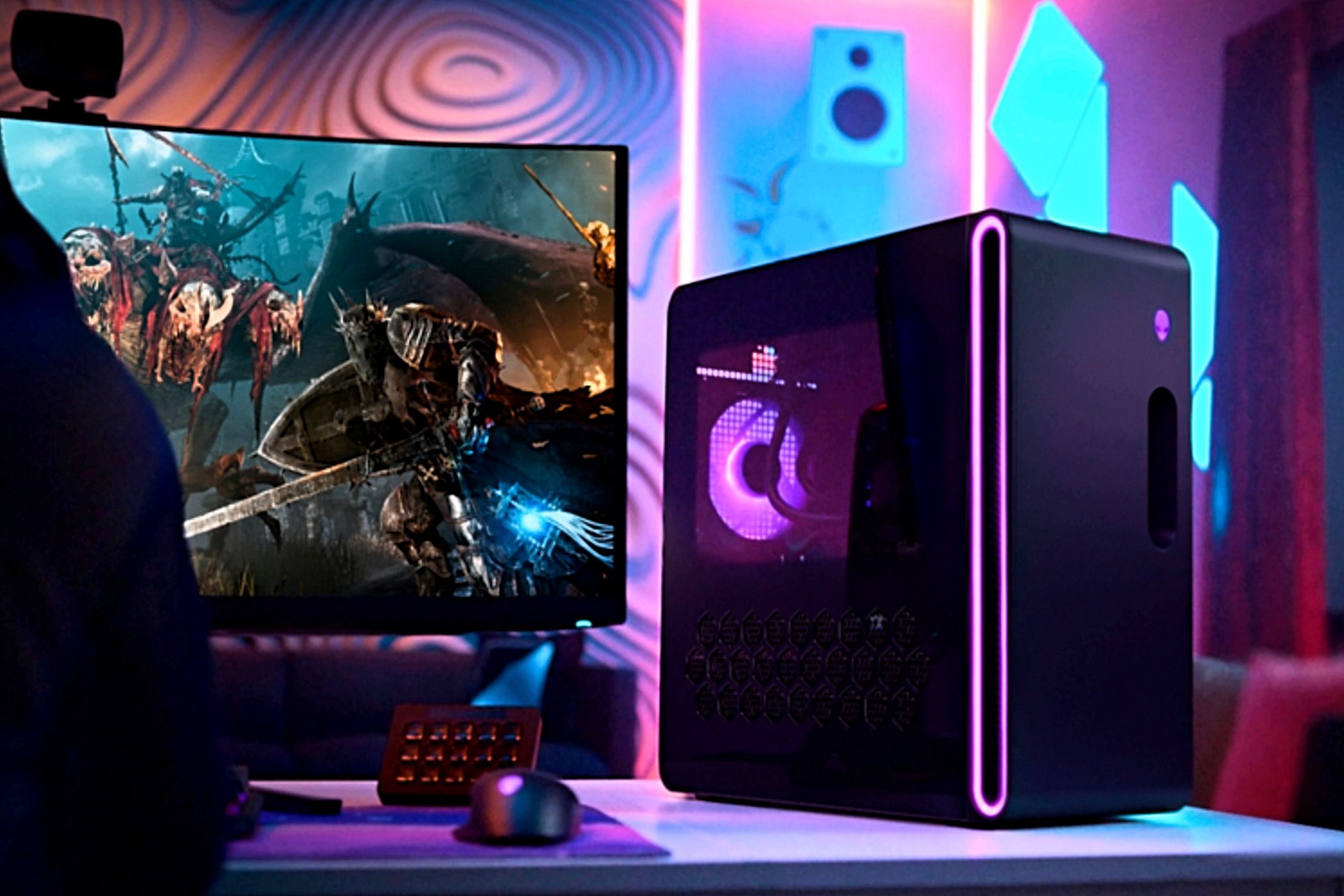 An Alienware Aurora R16 Gaming Desktop next to a monitor