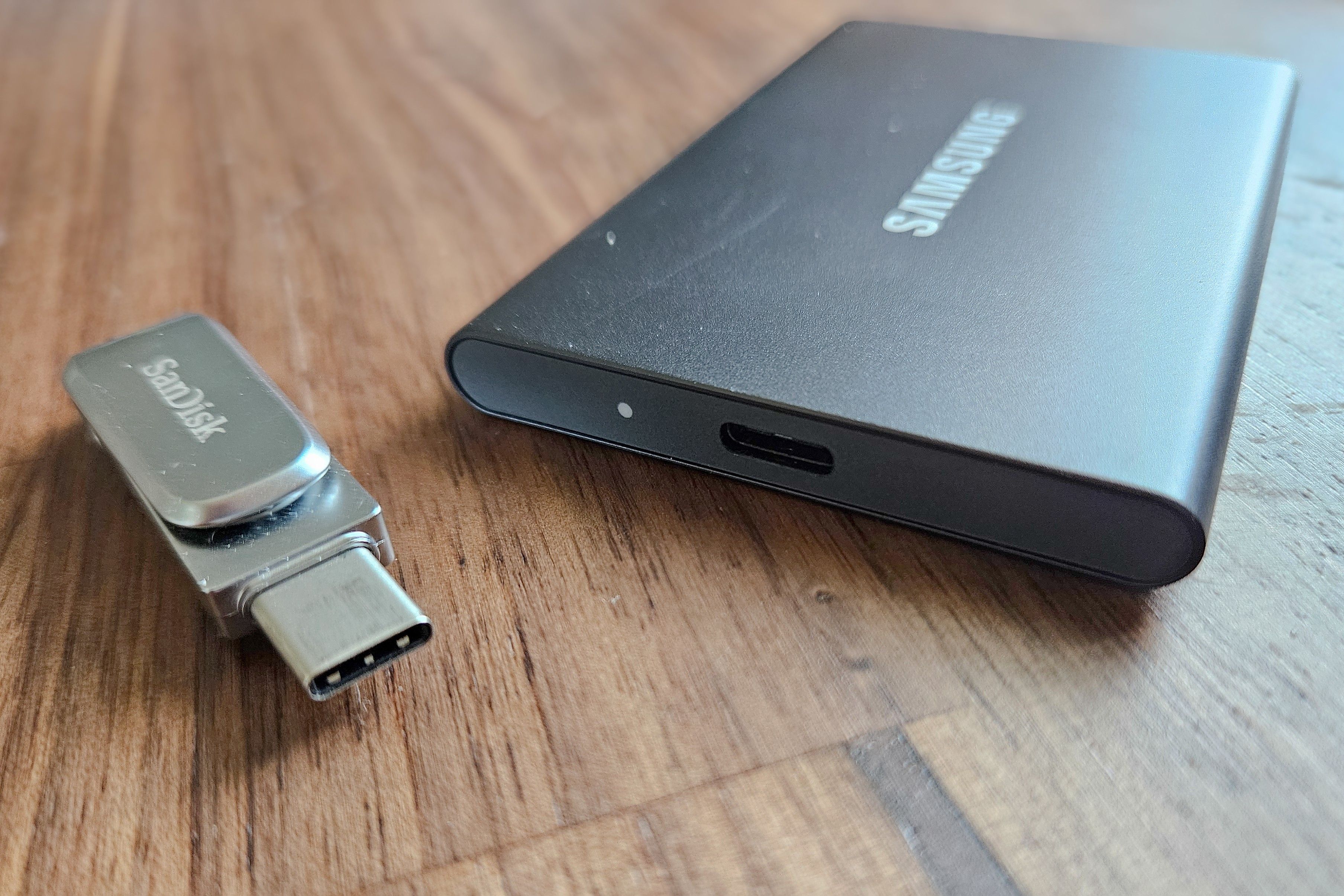 A USB-C flash drive next to an external SSD