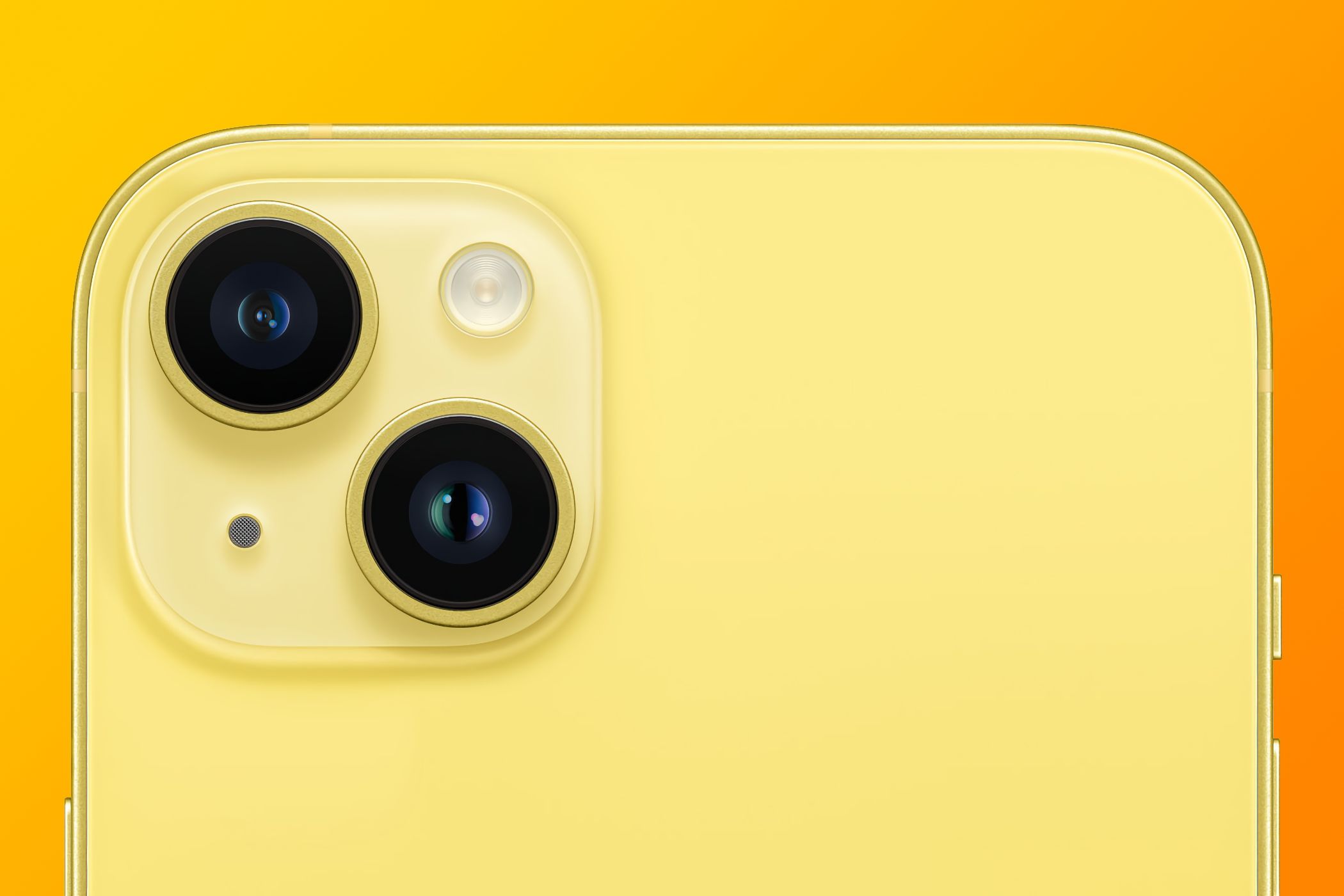 A closeup of the rear cameras on yellow iPhone 14 Plus, set against an orange gradient background.