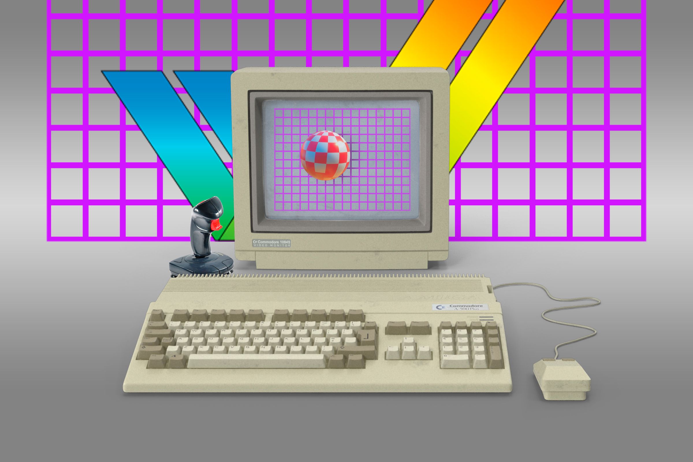 A Commodore Amiga 500 home computer with a mouse and joystick, plugged into a monitor displaying the famous 1984 Boing Ball demo.