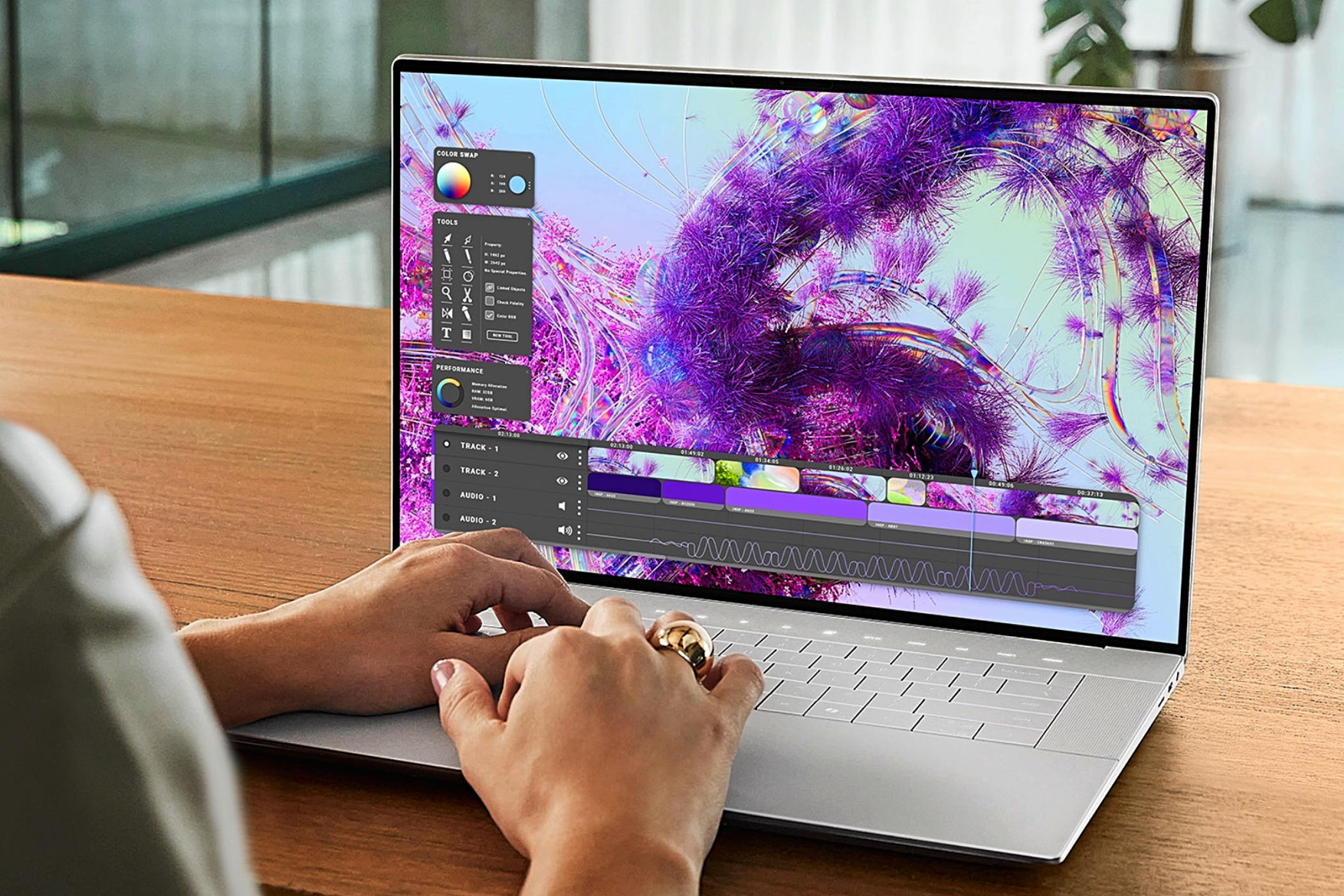 A woman using a Dell XPS Laptop with vibrant screen on display.
