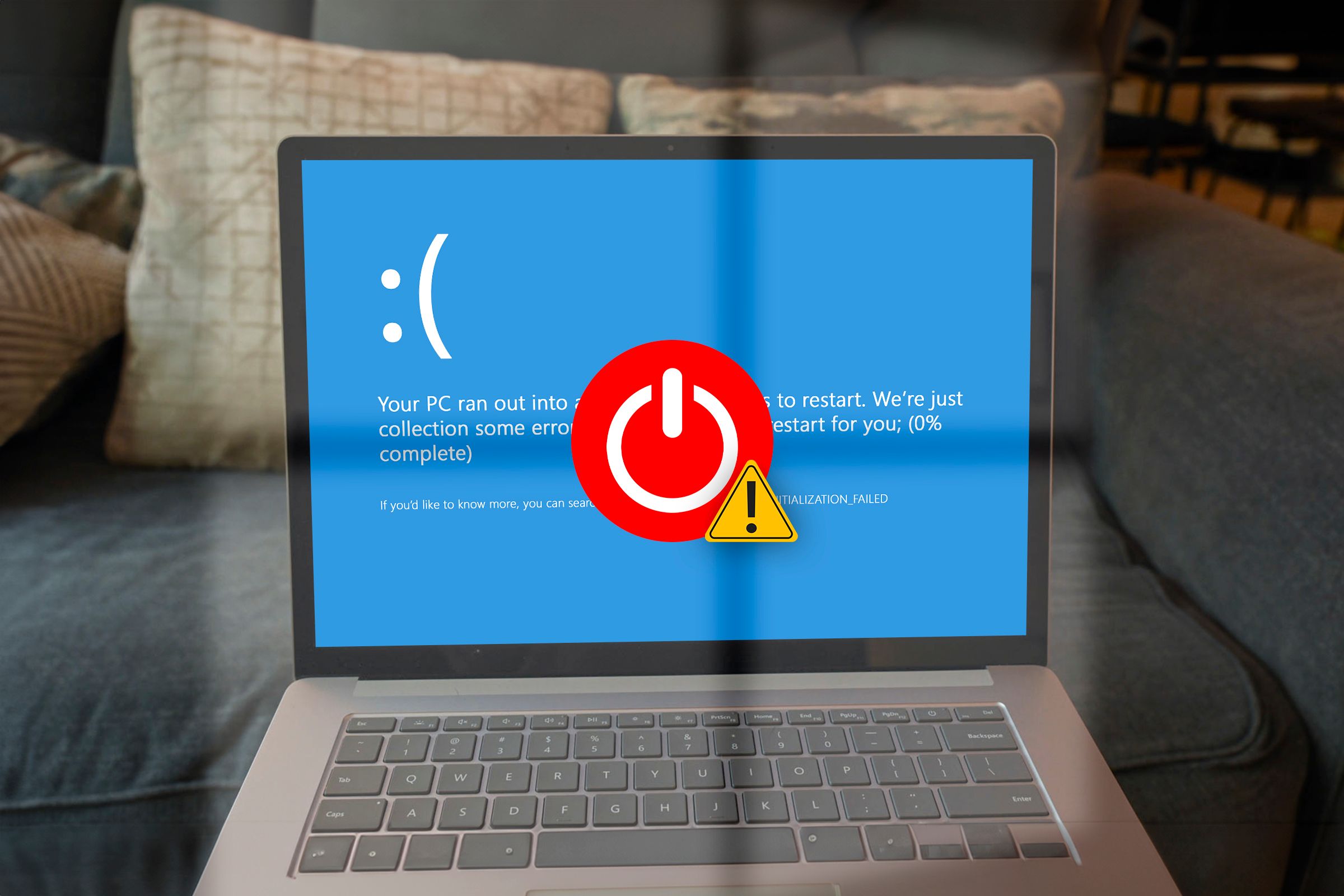 Open laptop displaying a Windows boot error screen with a boot icon and warning alert in front, at the center of the screen.