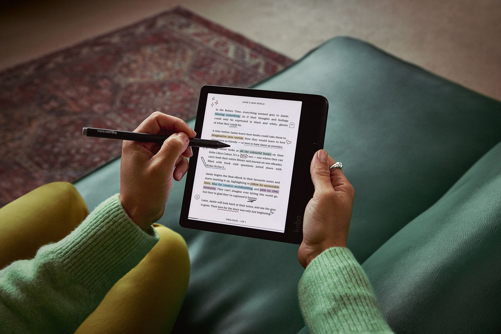 Person writing on a color Kobo with a stylus.