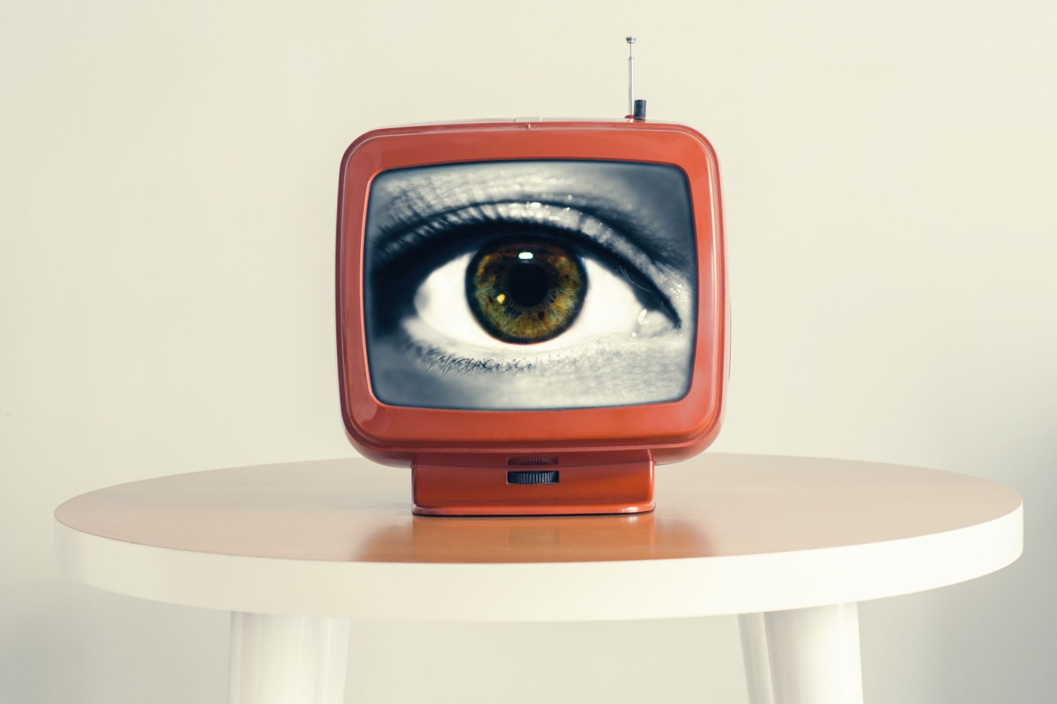 An eye in an old retro TV screen, always watching.
