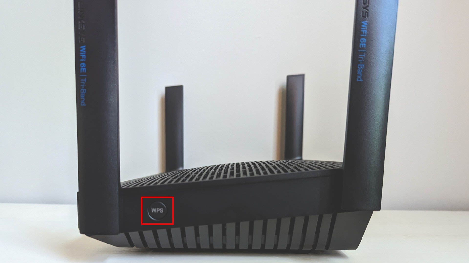 Side panel with WPS button on the Linksys Hydra Pro 6E router.