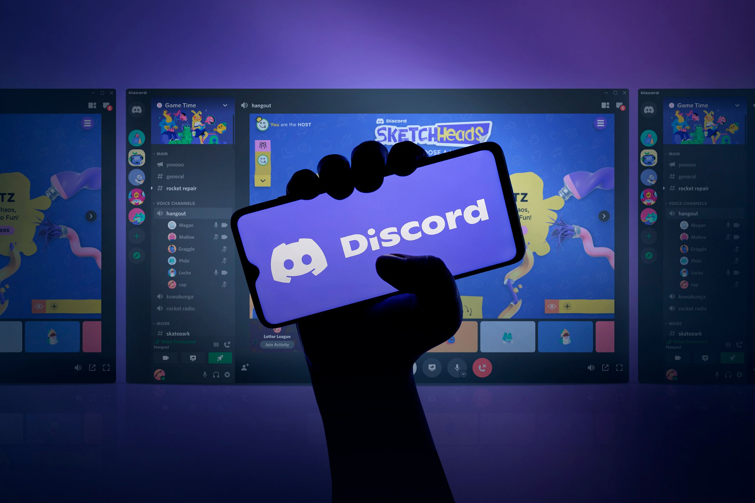 A hand holding a smartphone with the Discord logo on the screen and, in the background, screens with Discord games