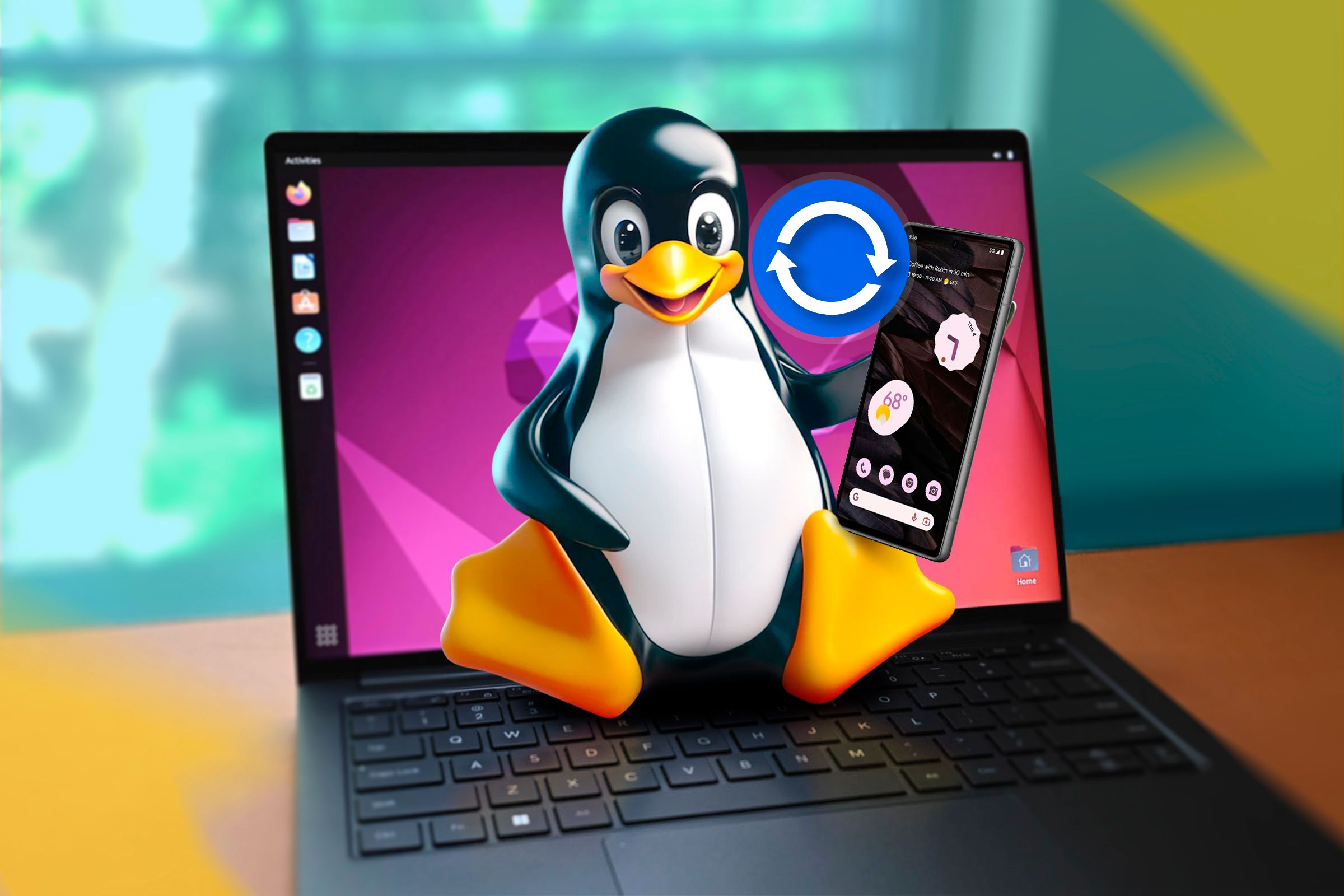 A Linux laptop with Tux sitting on the keyboard holding an Android phone