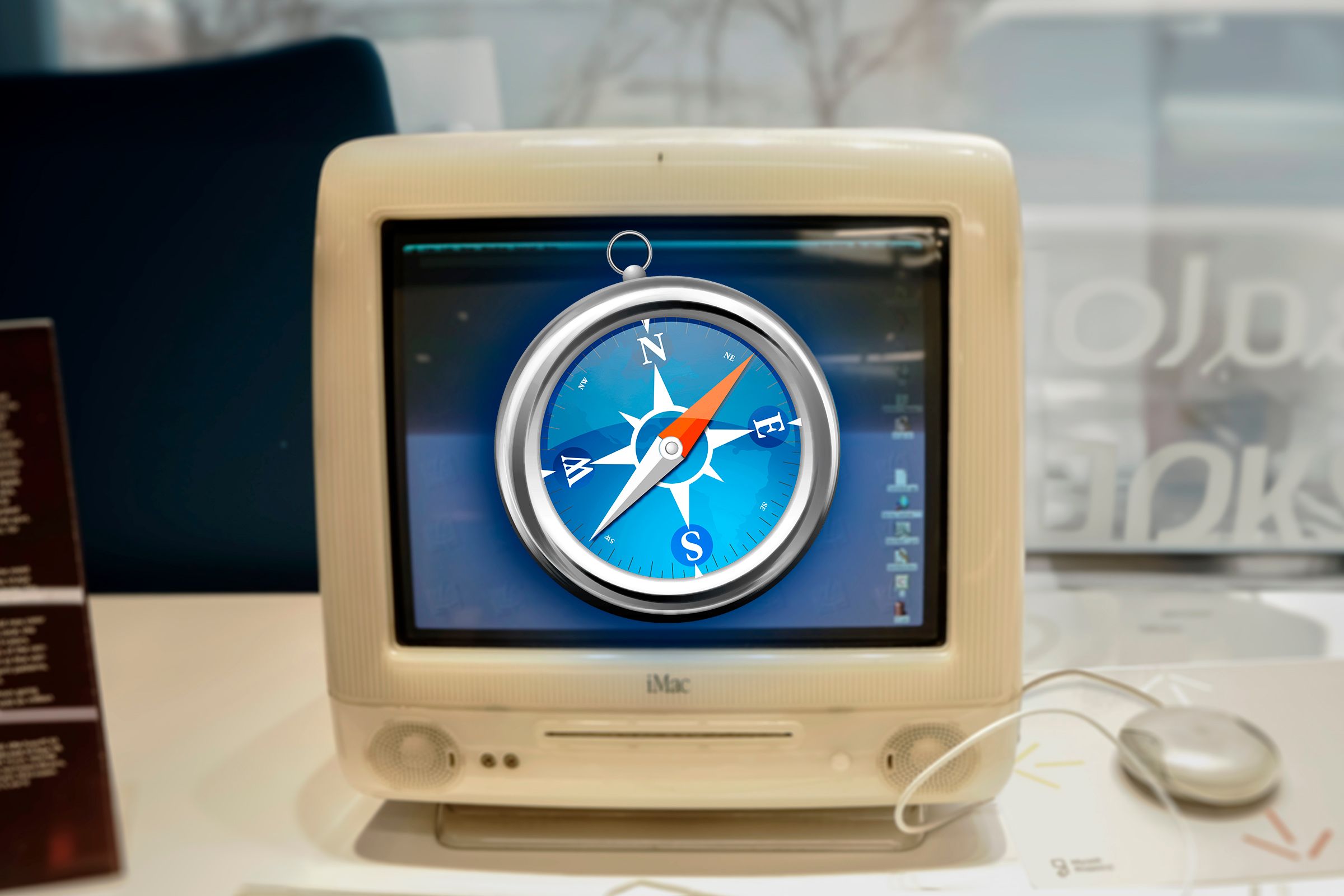 An iMac G3 with the old Safari logo.