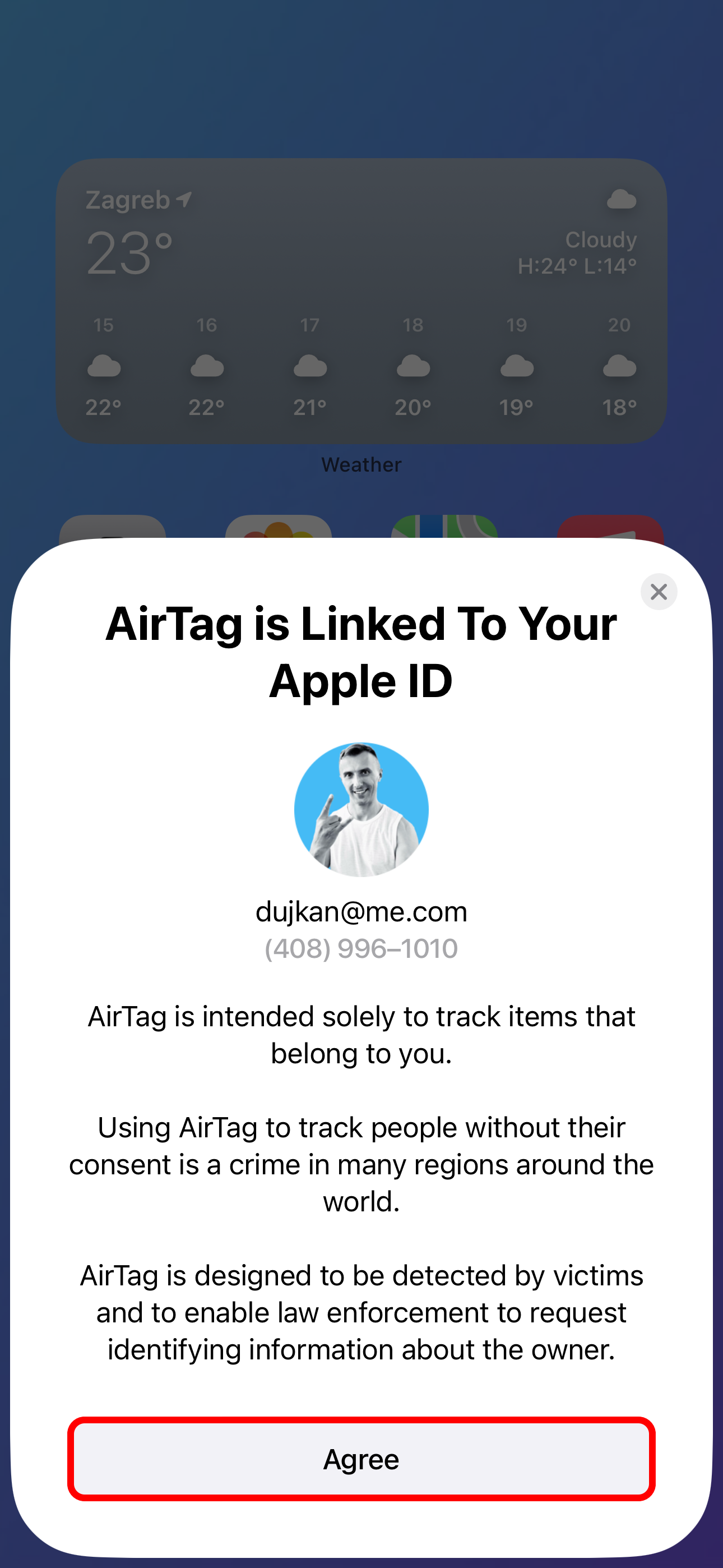 The Agree screen on an AirTag setup card on iPhone.