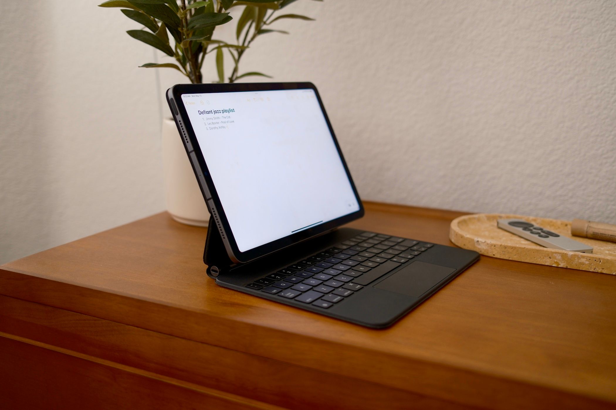 iPad sitting on a table in the magic keyboard