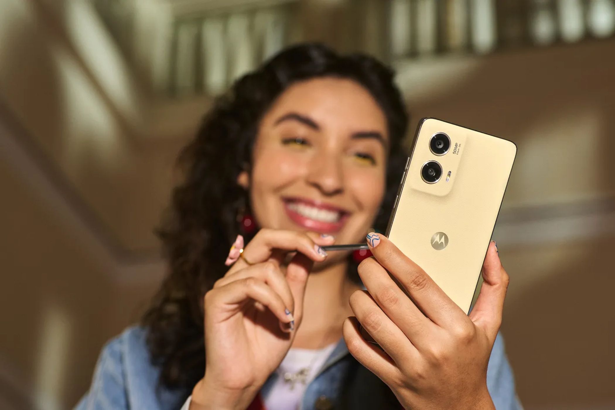 A woman using a stylus on the new Moto G Stylus 5G for 2024. 