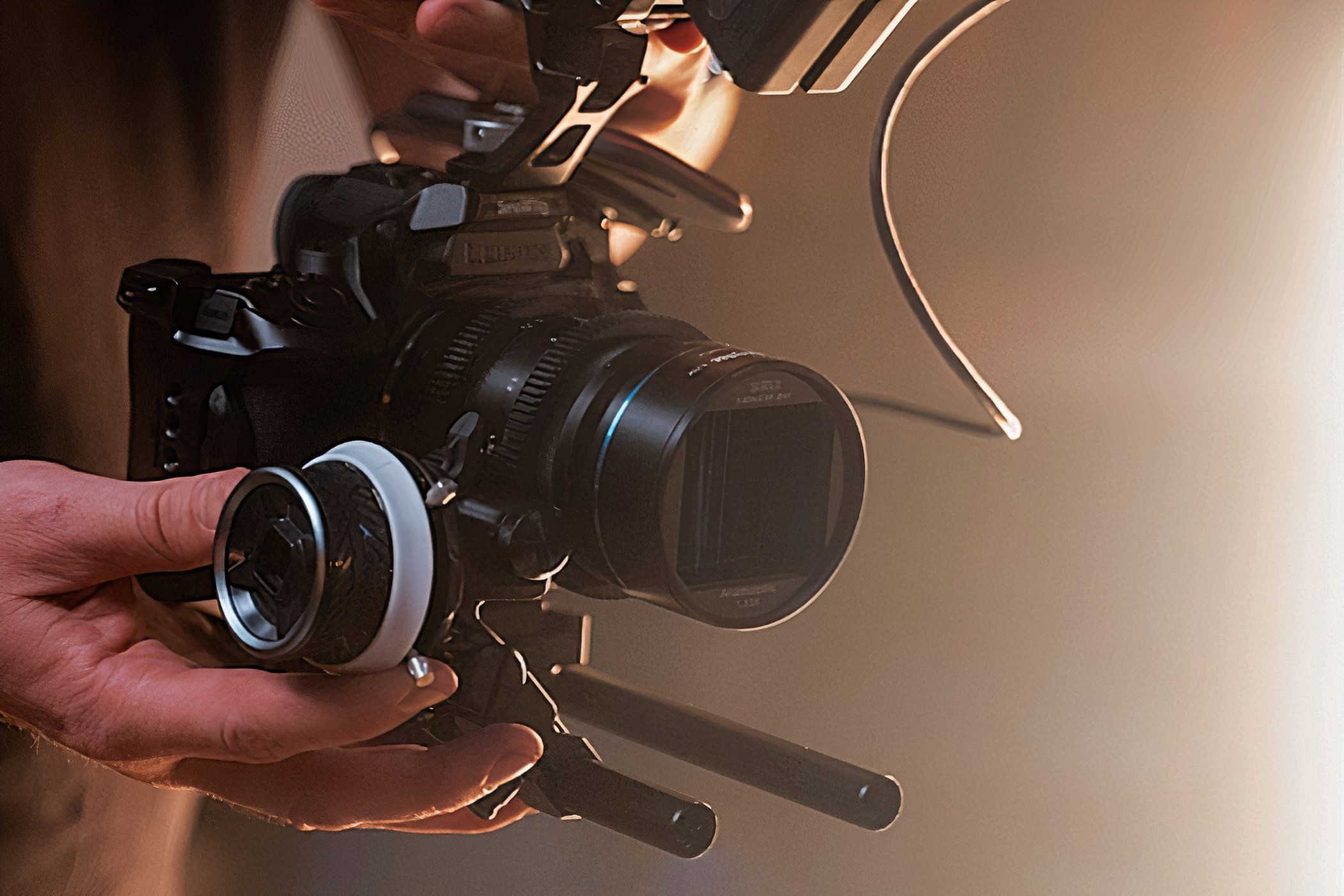 A person using the Panasonic LUMIX S5 IIX to record video.