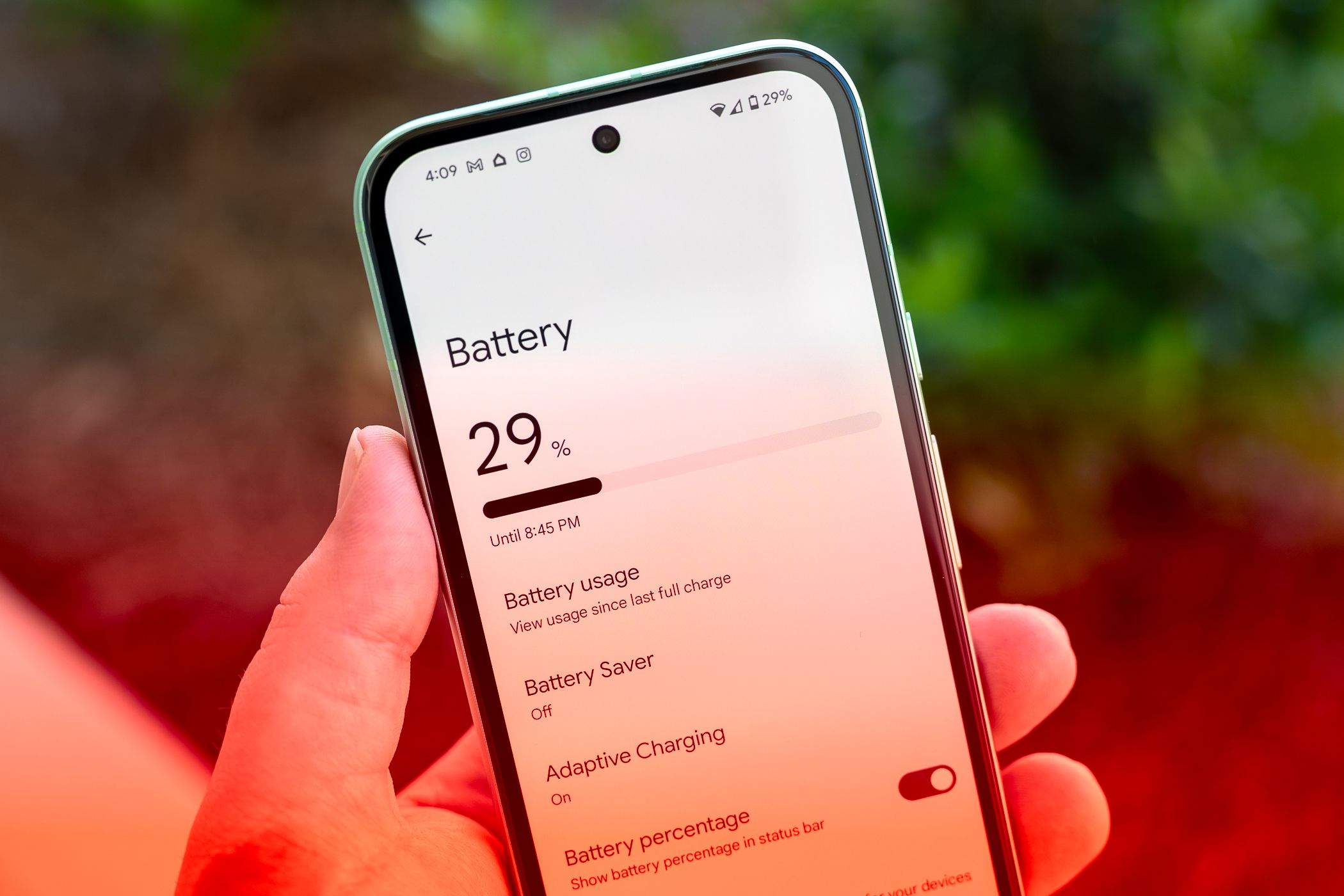 Person holding the Google Pixel 8a showing the Battery menu.