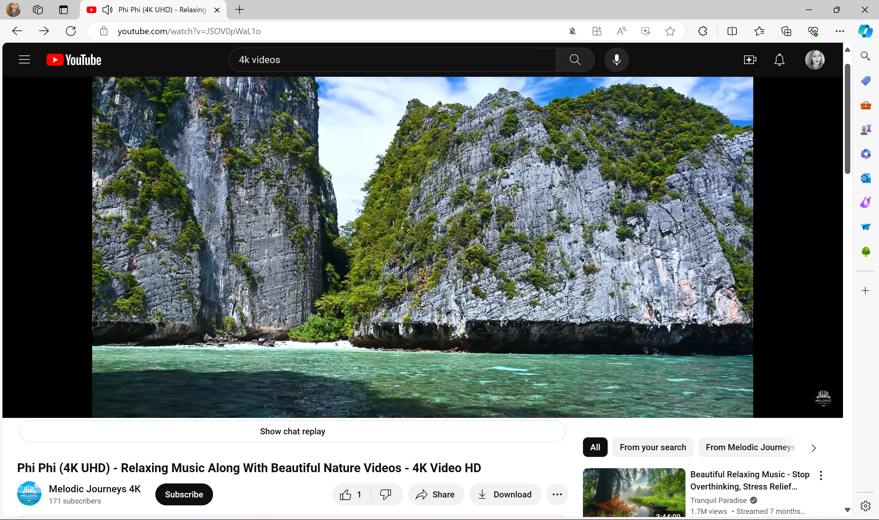 A screenshot of a YouTube video showing a lush cliffside in Thailand.