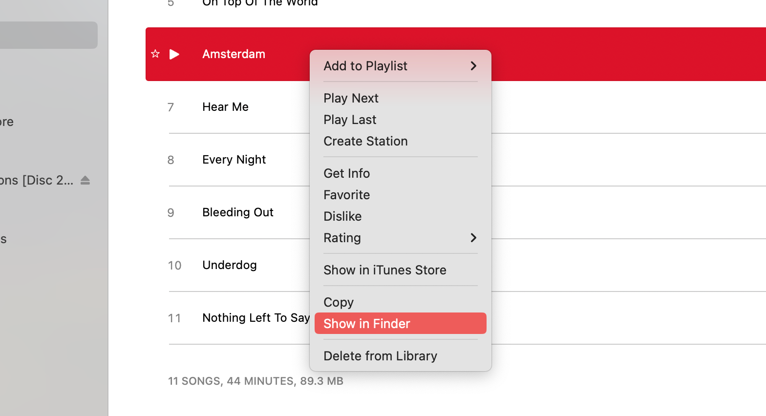 Context menu open on a song with "Show in Finder" selected.