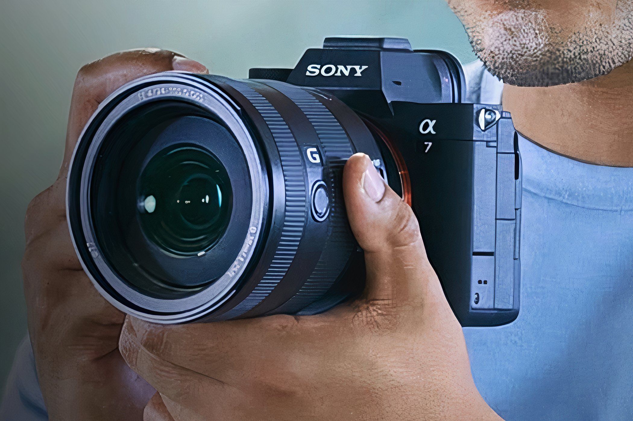 A man holding a Sony Alpha 7 IV.