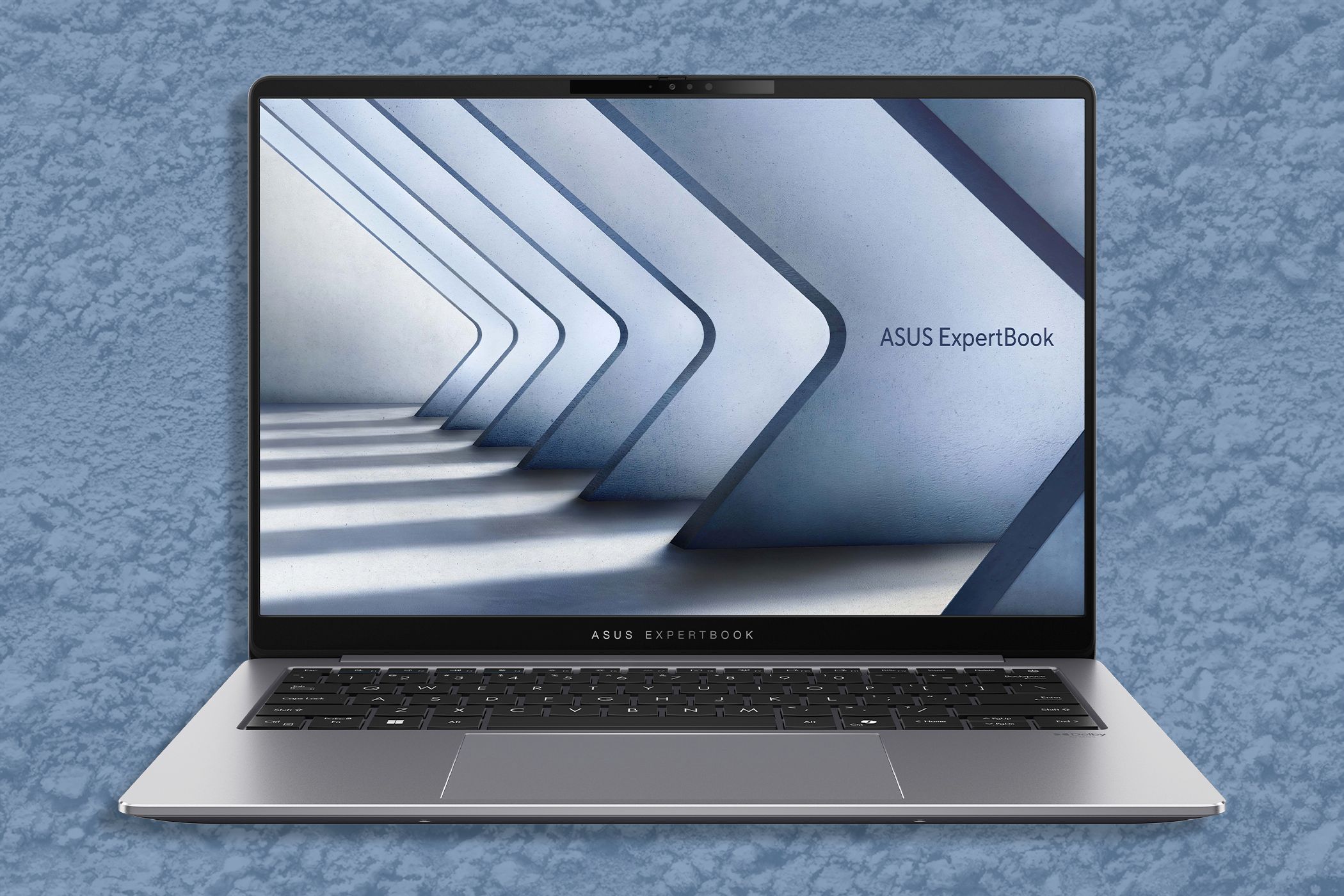 The ASUS ExpertBook P5 laptop on a blue background.