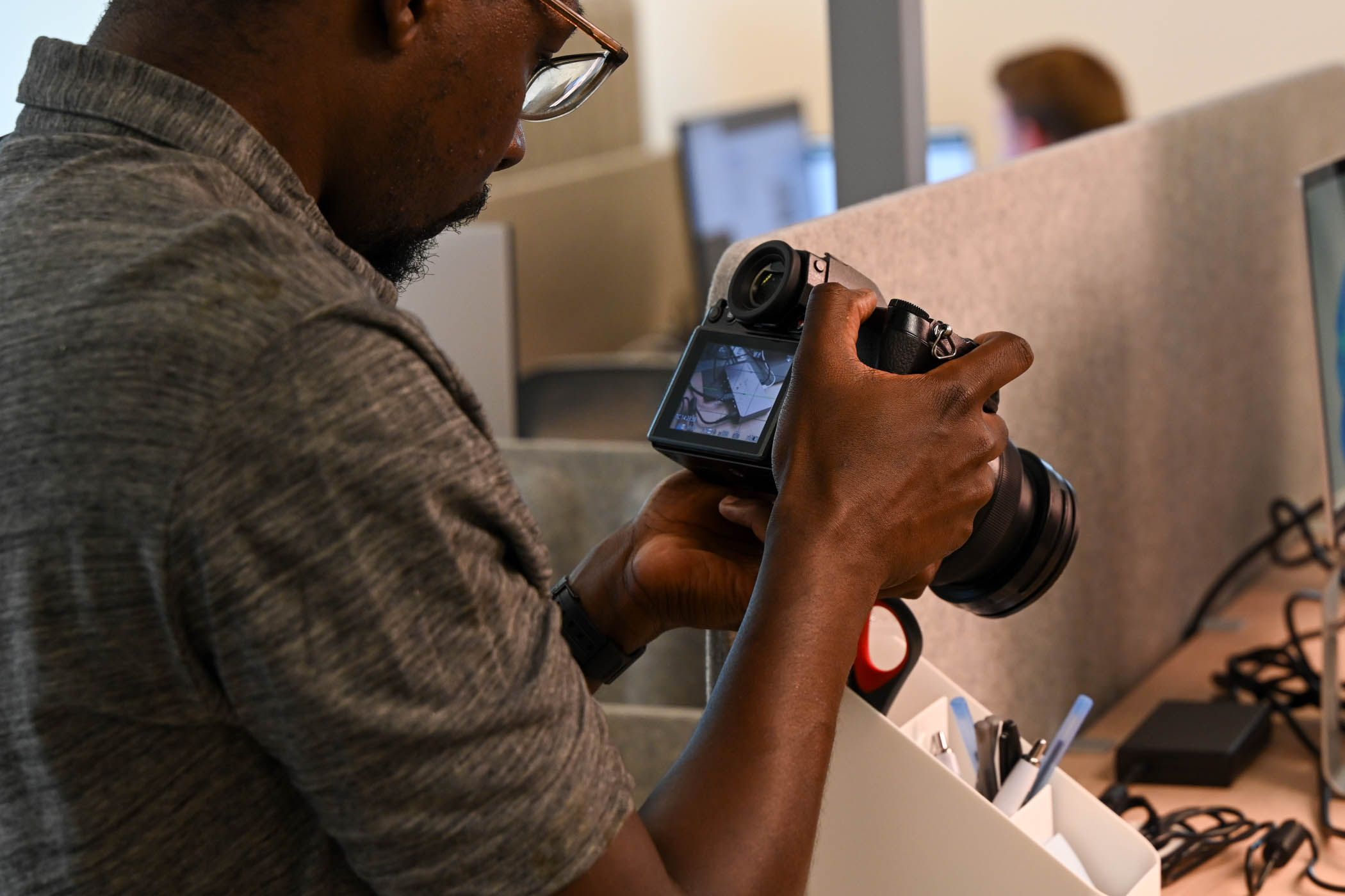 Person taking photos of a desk