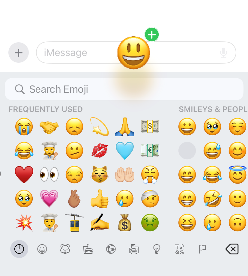 A smiley face emoji hovering over the textbox in iMessage