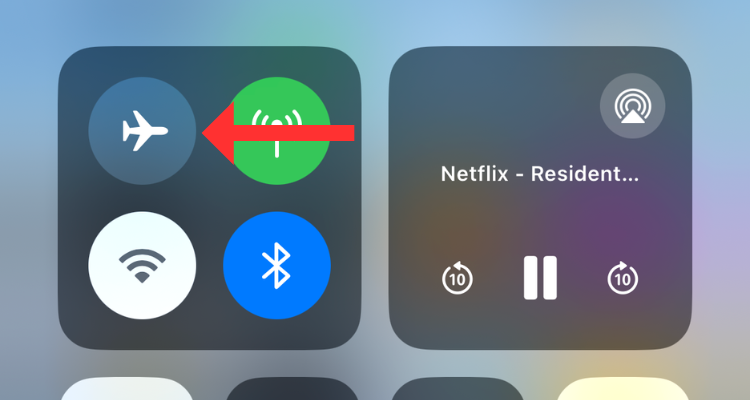 Screenshot of the Control Center with an arrow next to the Airplane mode toggle.