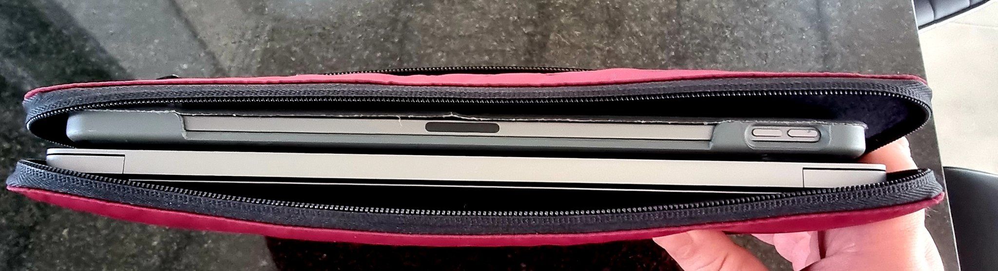 An iPad and MacBook inside a single laptop sleeve.