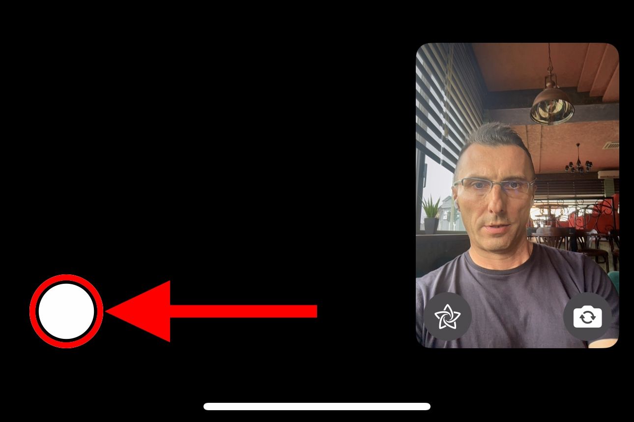A FaceTime video call on iPhone with the Live Photo shutter button highlighted.