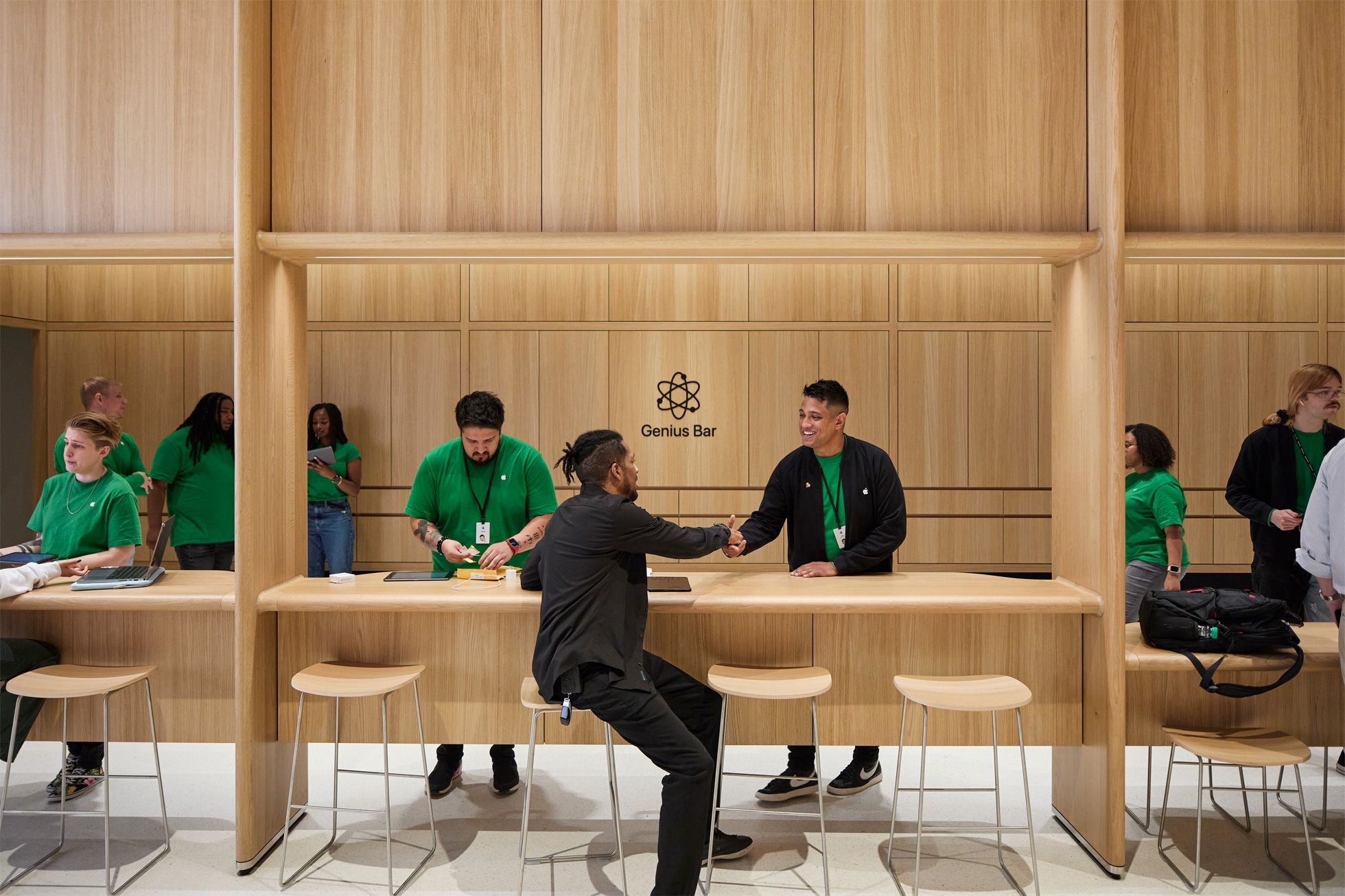 A technician greeting a customer at the Genius Bar in Apple&rsquo;s Tysons Corner retail store in Virginia, United States.