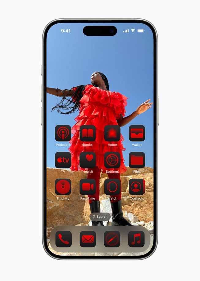 An iPhone with custom red icons and a person in a red dress as the wallpaper.