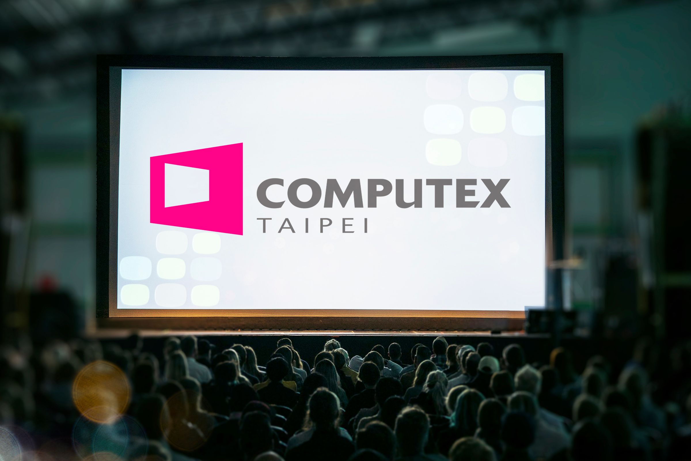 Computex Taipei logo on a screen with an audience watching.