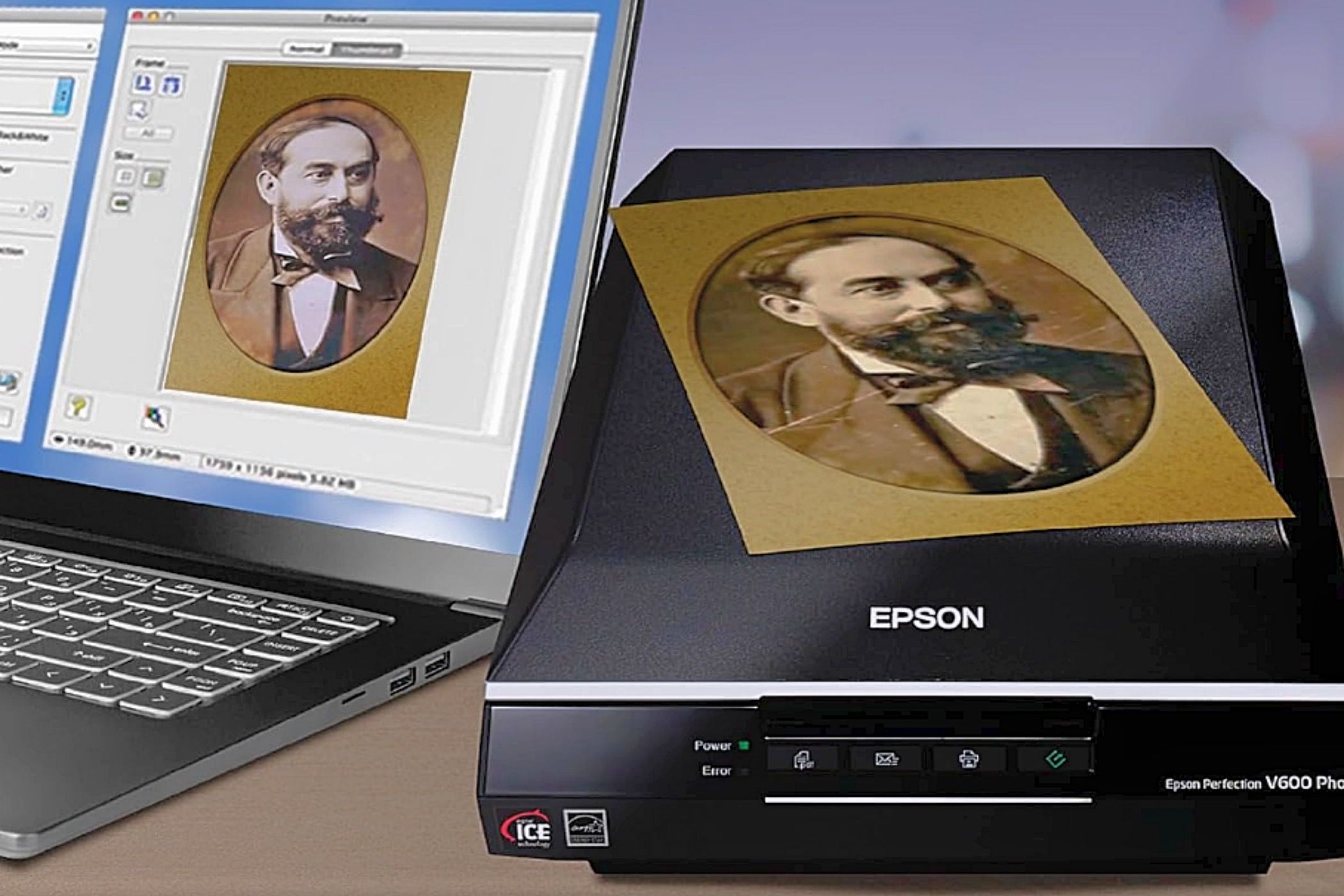 An Epson Perfection V600 photo scanner next to a laptop