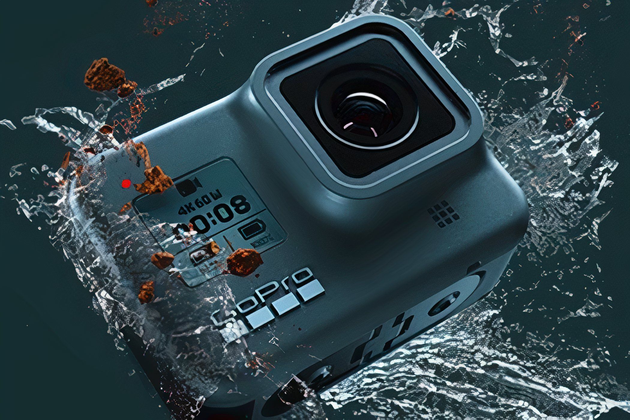 A GoPro HERO8 Black splashing in the water.