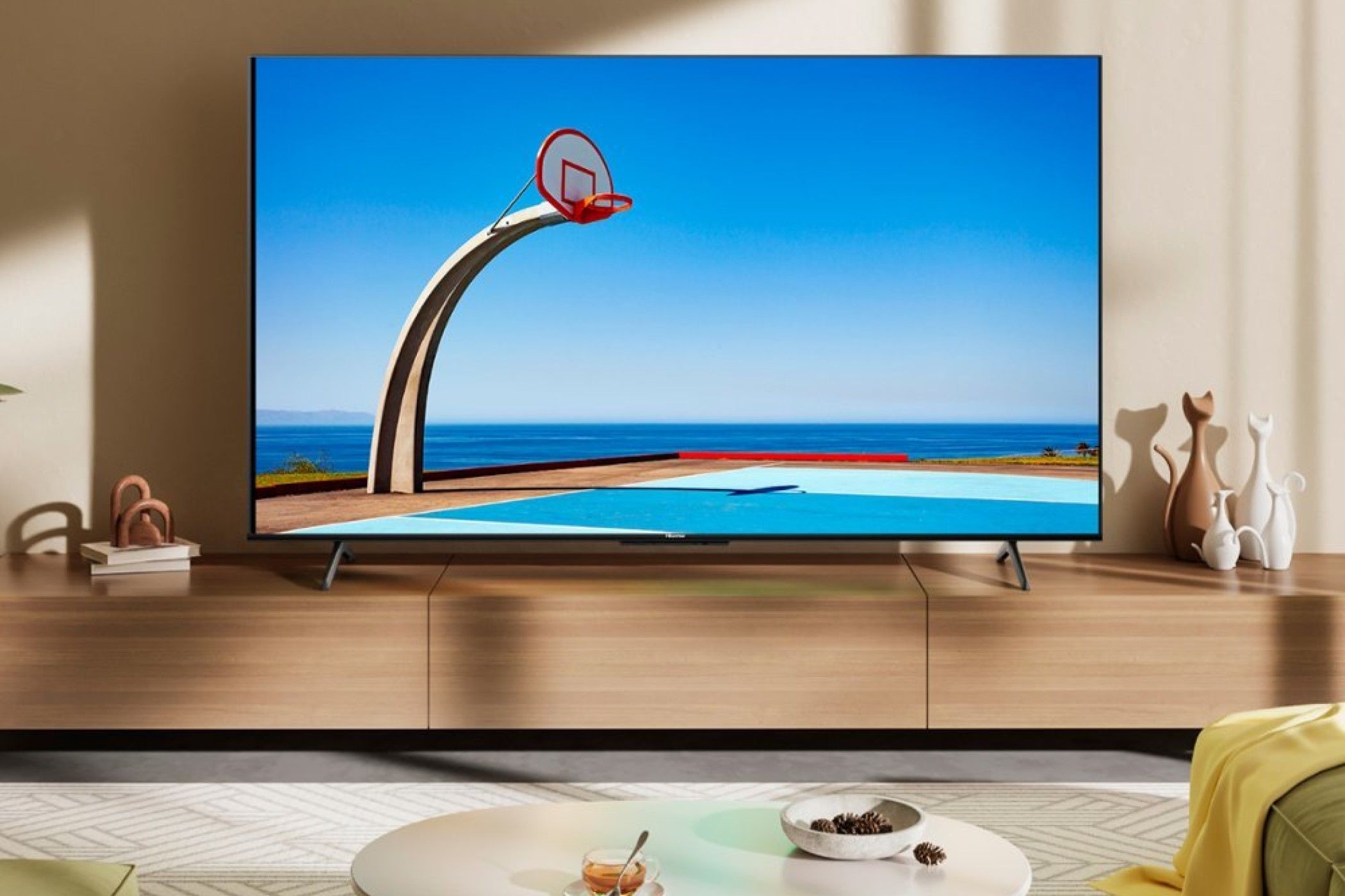 A Hisense U6N in a room on top of a TV stand. 