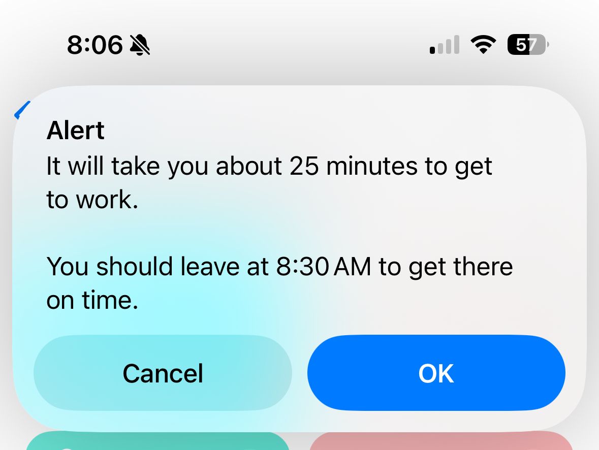 Alert showing travel time to work after running an iPhone shortcut.