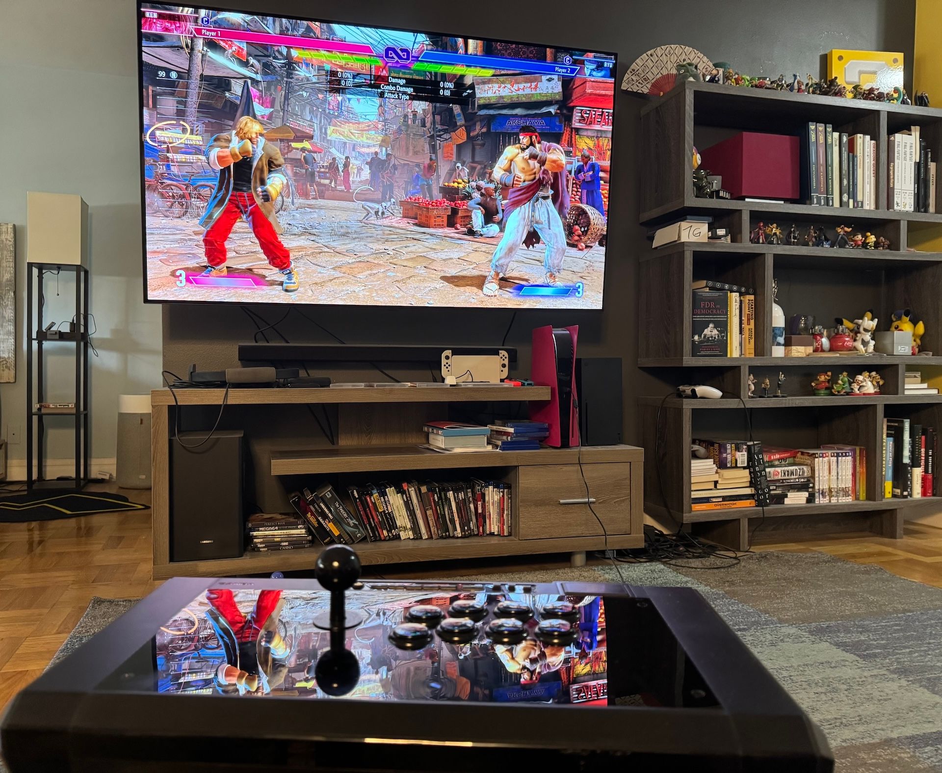 Street Fighter 6 on a television screen and a fight stick in the foreground.