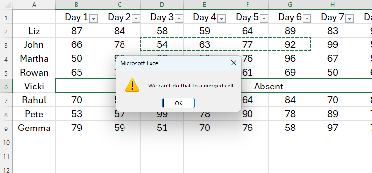 An Excel spreadsheet with an error message reading 'You can't do that to a merged cell.'