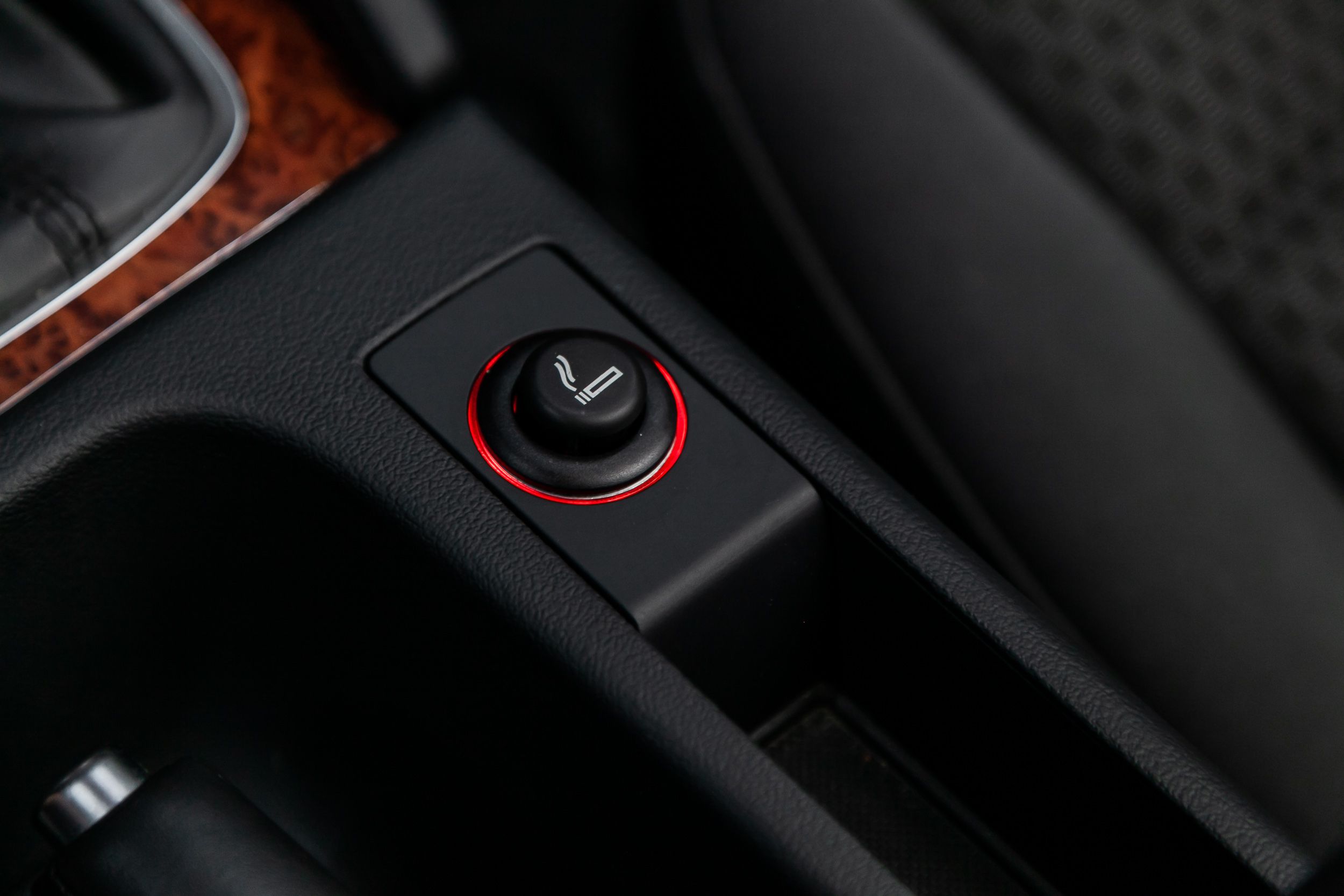 Close up of a cigarette lighter. modern car interior.