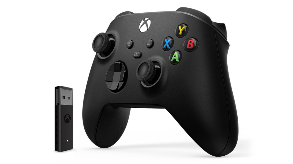 The Xbox Wireless adapter next to a controller.